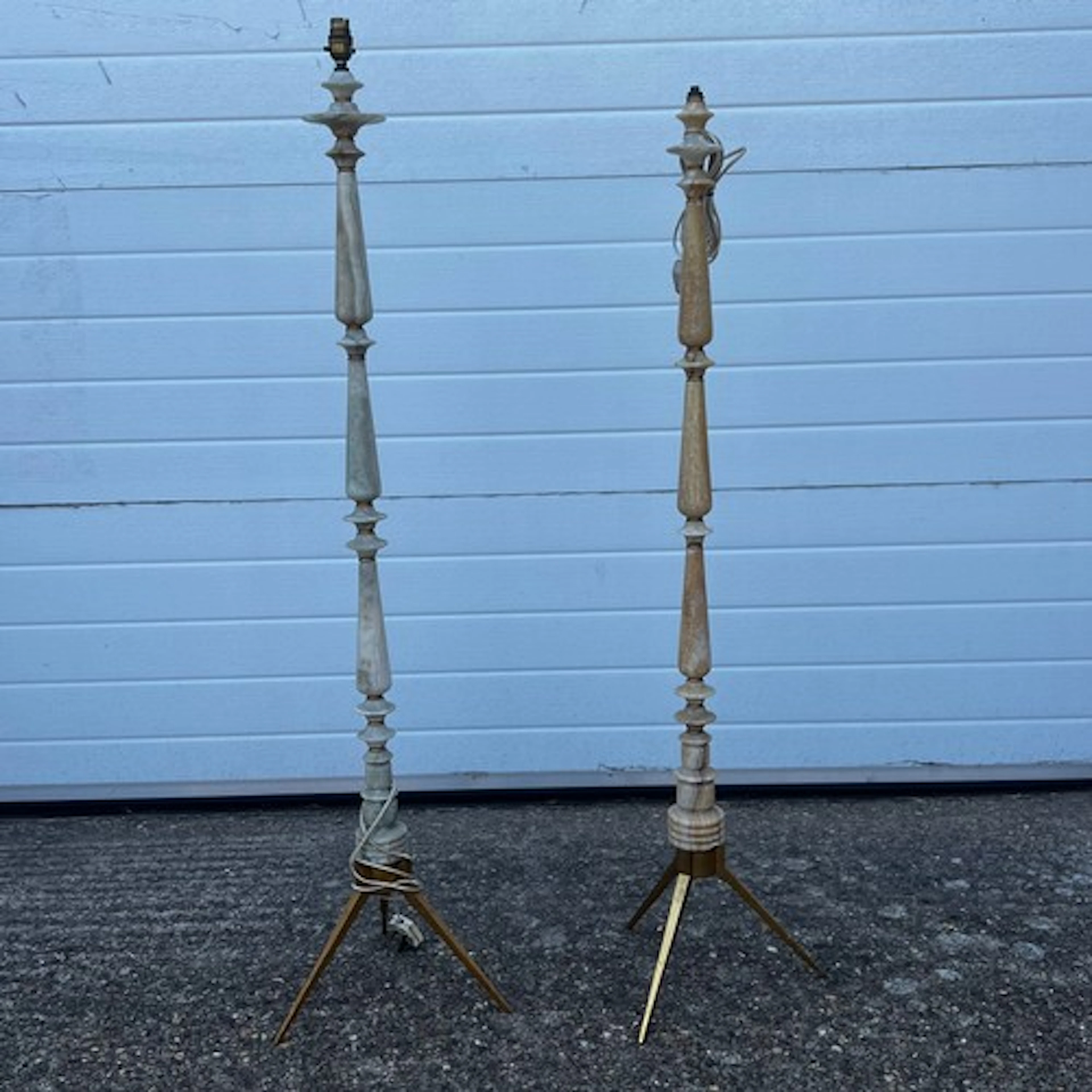 A pair of Mid-Century onyx standing floor lamps on metal tri...