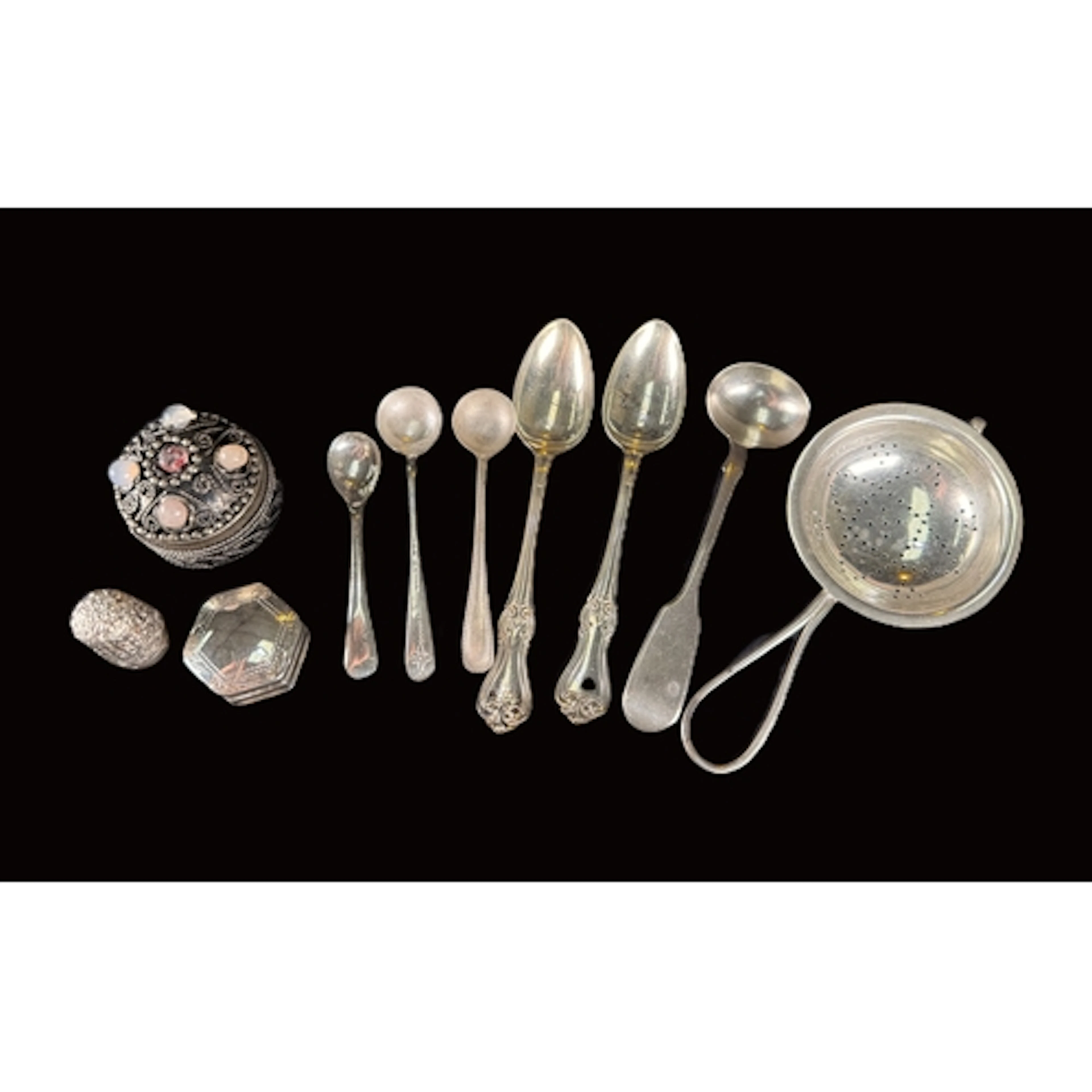 A hallmarked silver tea strainer, Birmingham 1912; 3 hallmar...