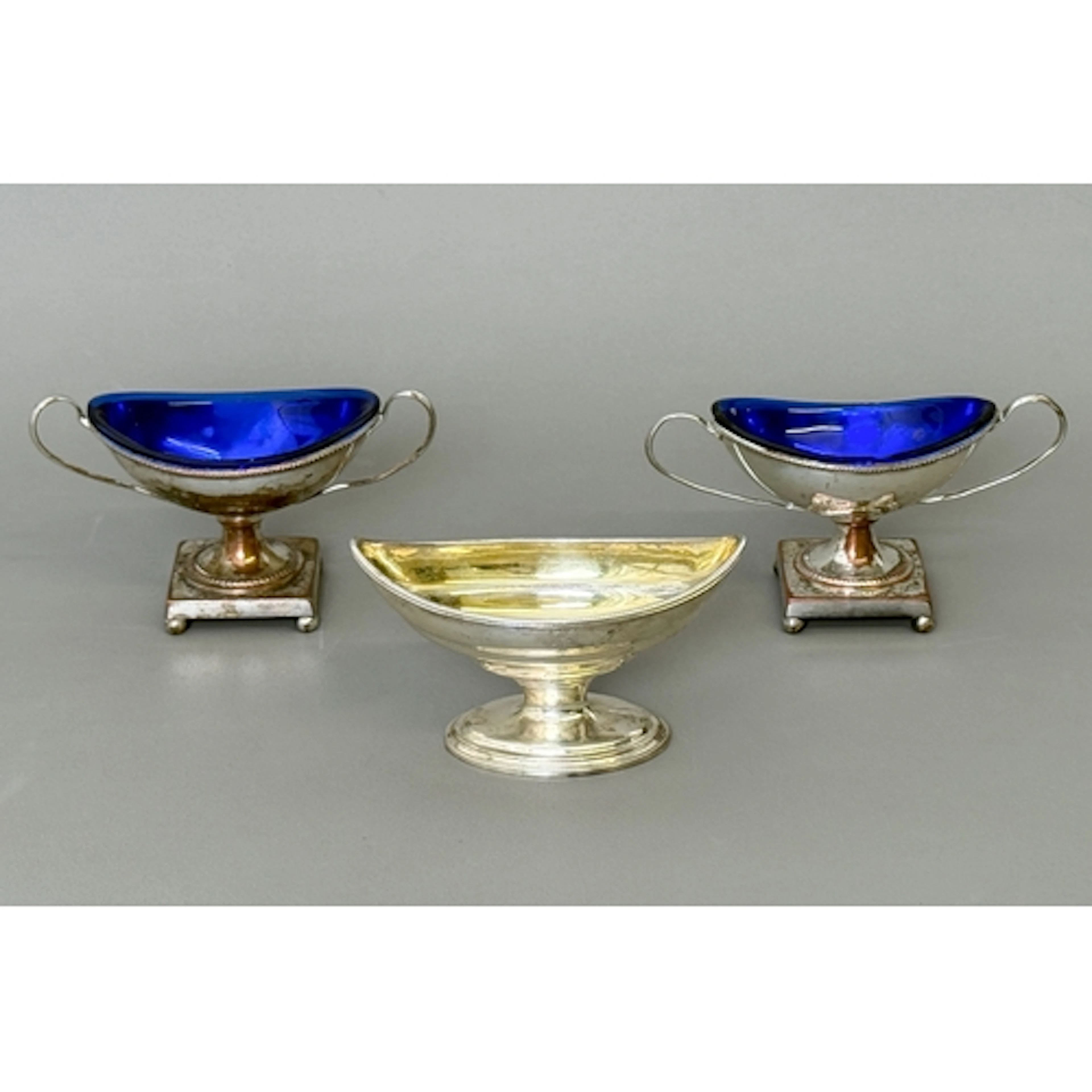 A George III silver navette shaped salt cellar - with pedest...