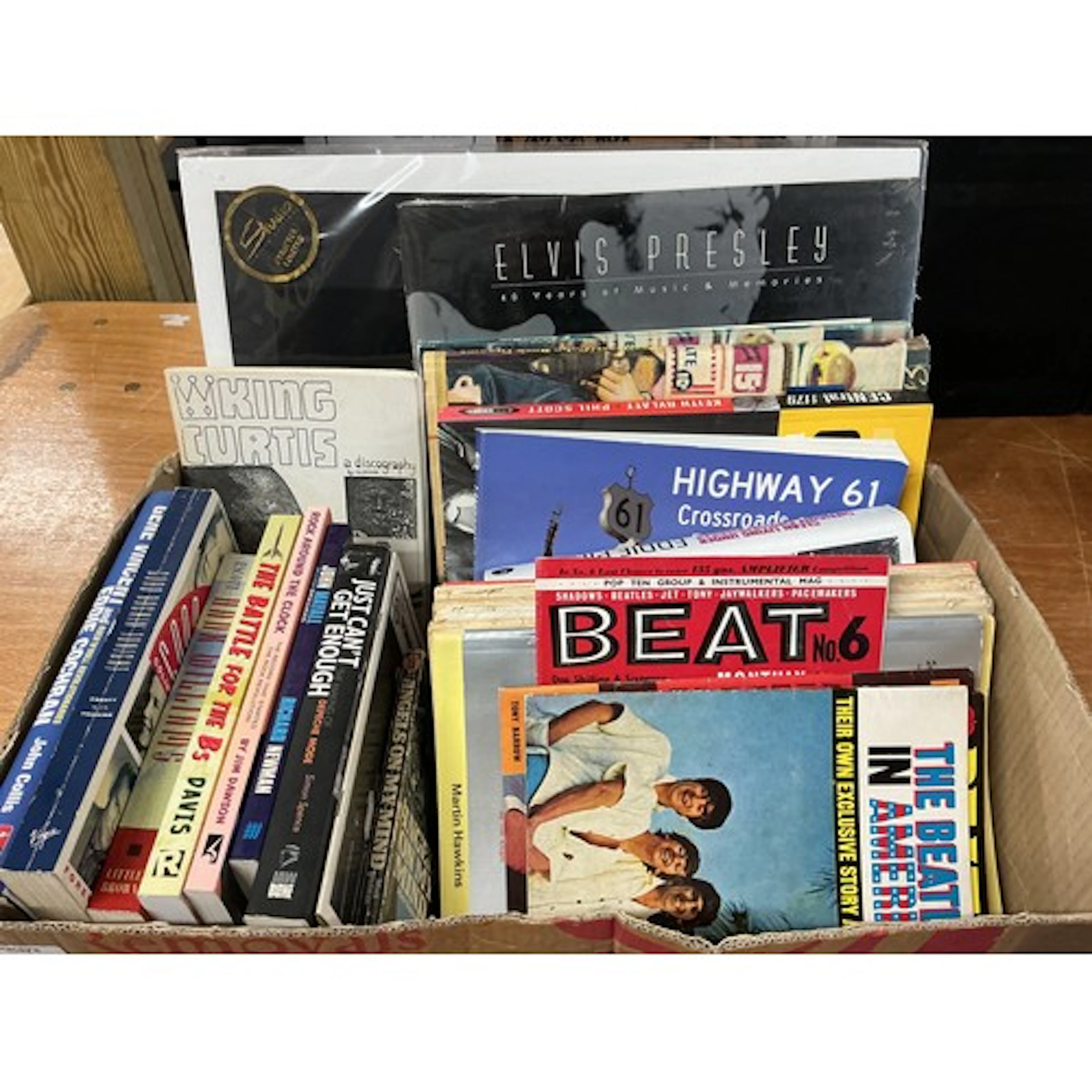 A box of music books and magazines.