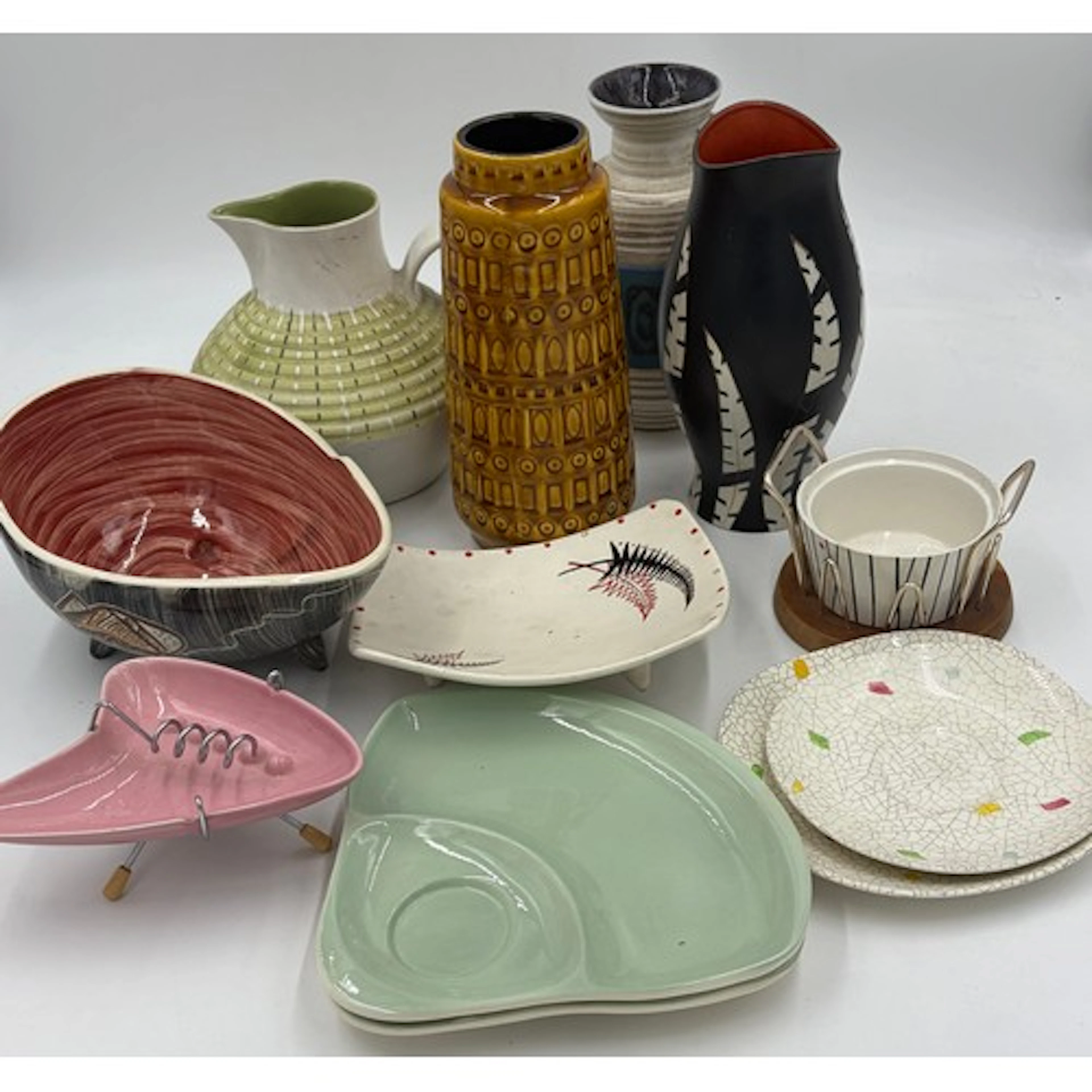 A collection of mixed studio pottery to include a Denby Burl...