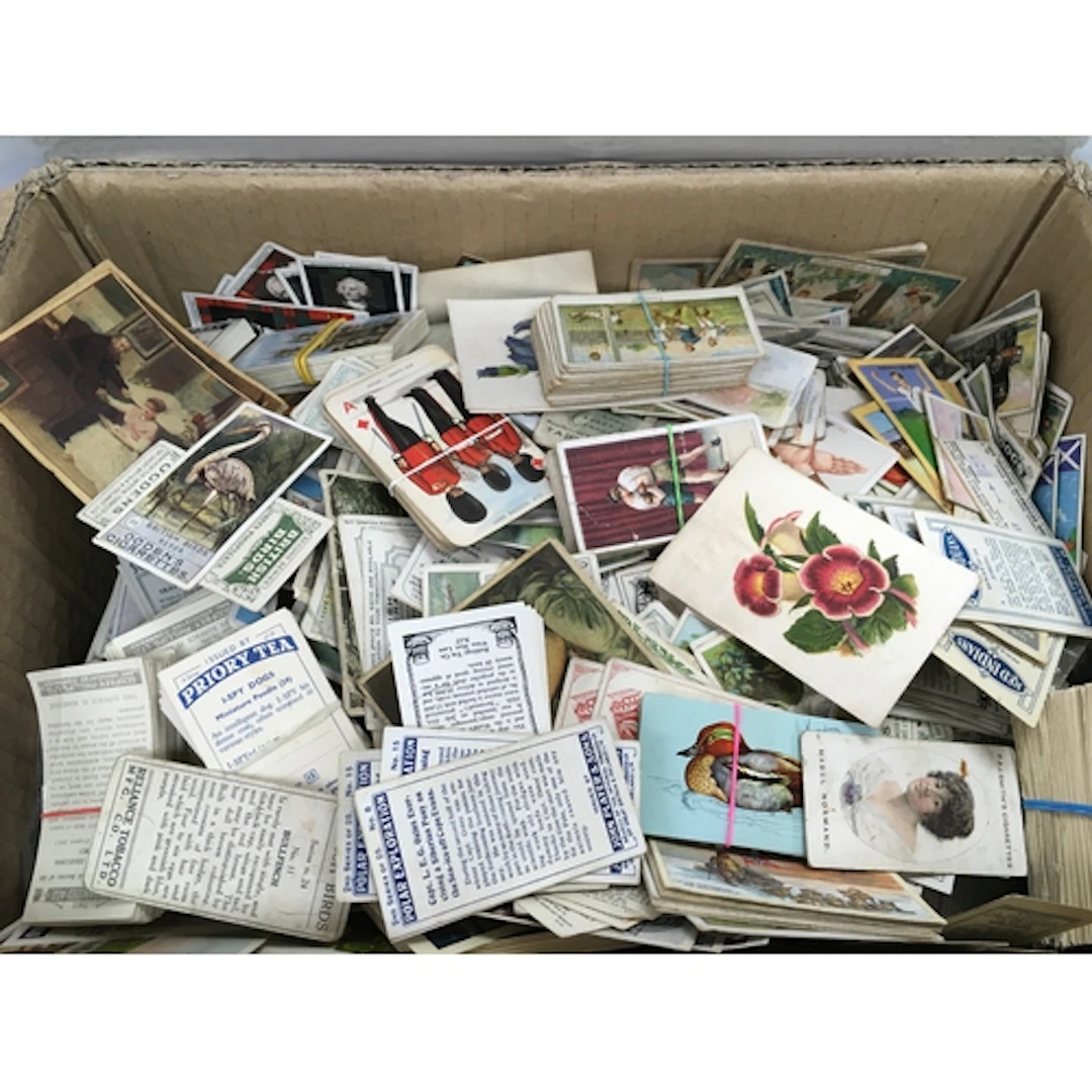 A box containing large collection of mixed cigarettes cards&...