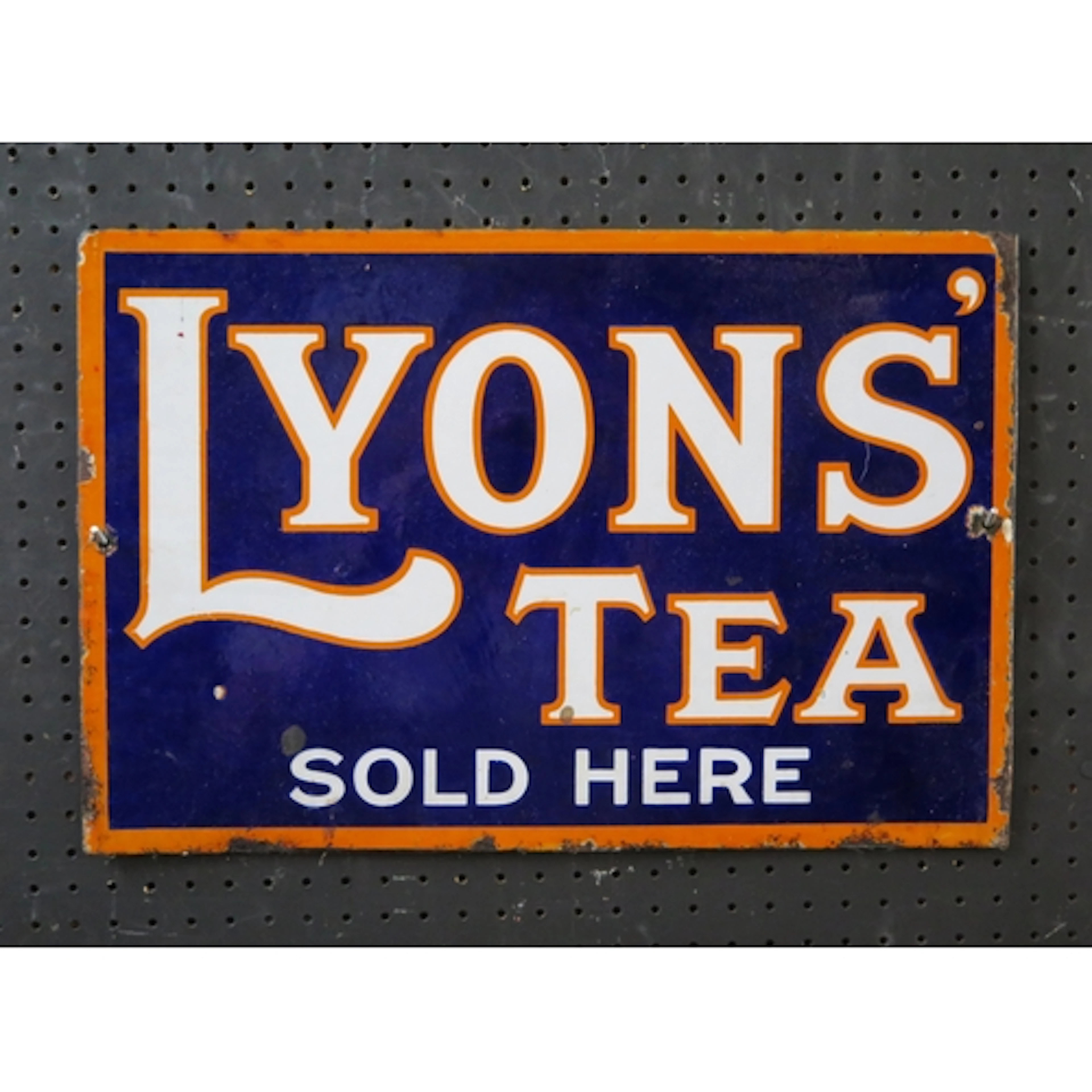 "Lyons tea Sold Here" - an enamel double-sided advertising s...