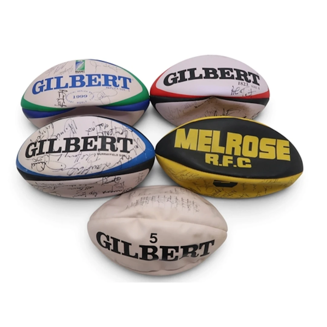 A group of four signed rugby balls, to include 1999 World Cu...