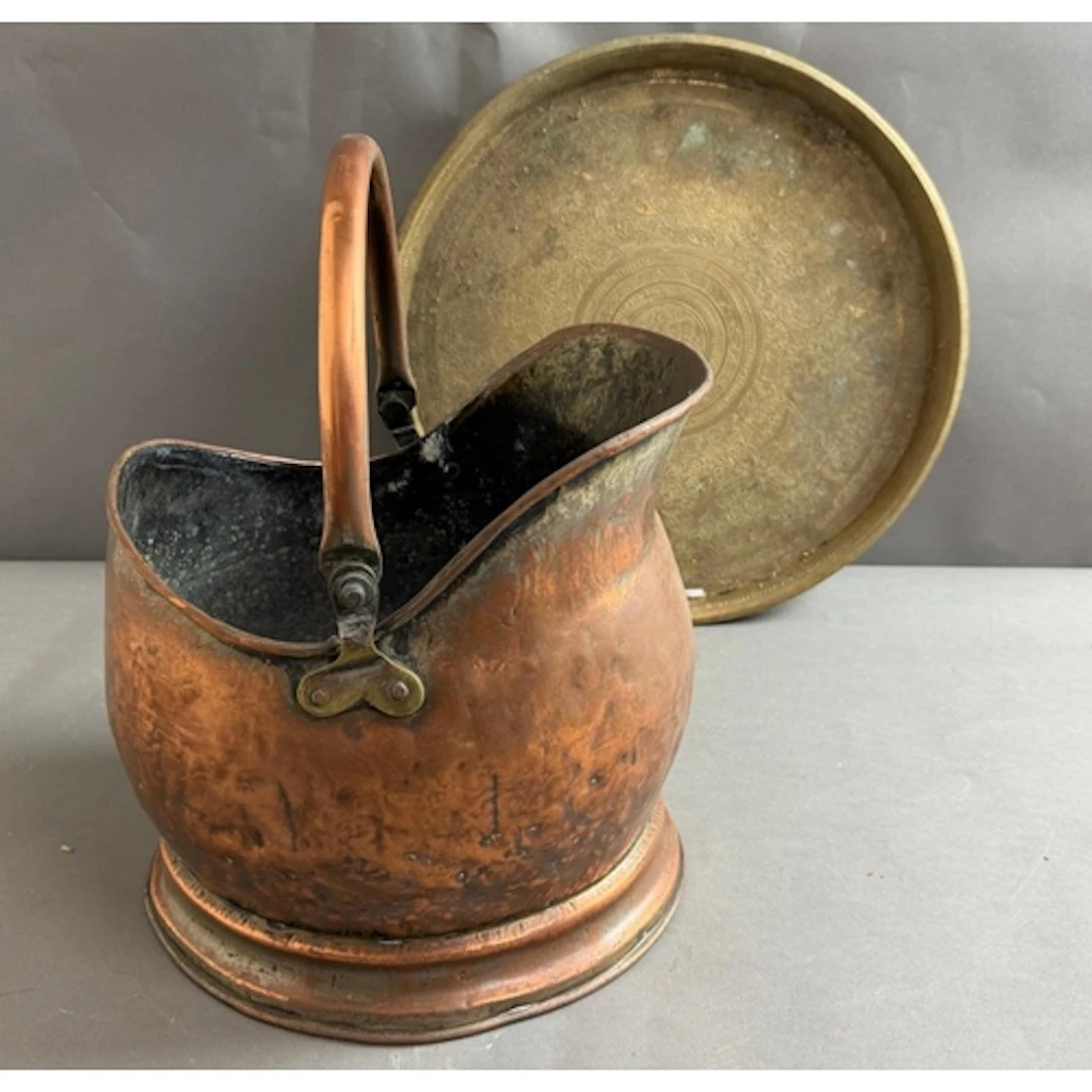A Copper helmet coal bucket or scuttle along with a brass tr...