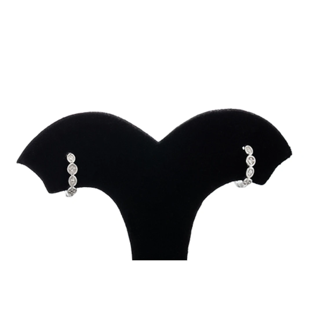 A PAIR OF HUGGIE DIAMOND EARRINGS, mounted in 14ct white gol...