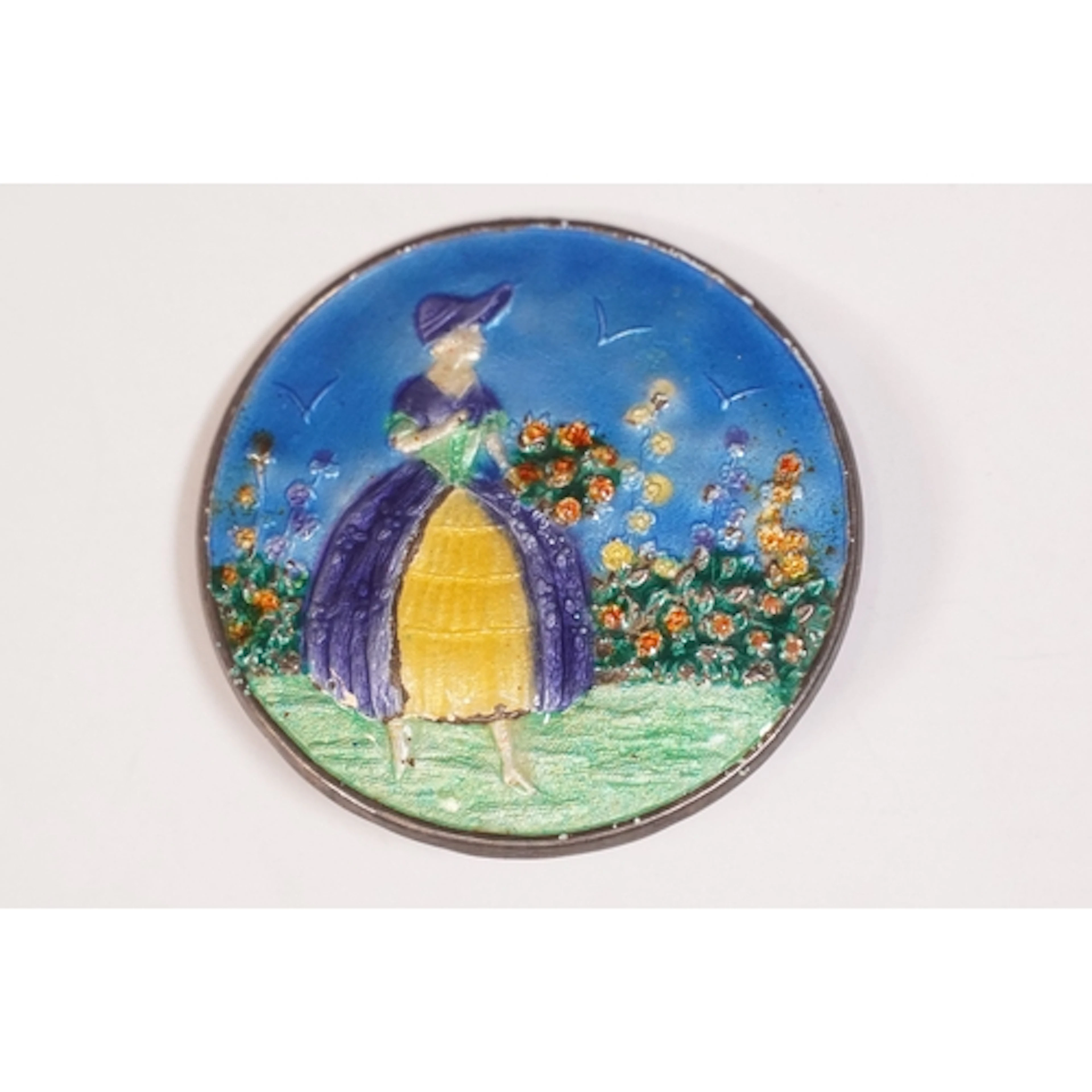 Mid-century silver and enamel brooch decorated with a crinol...