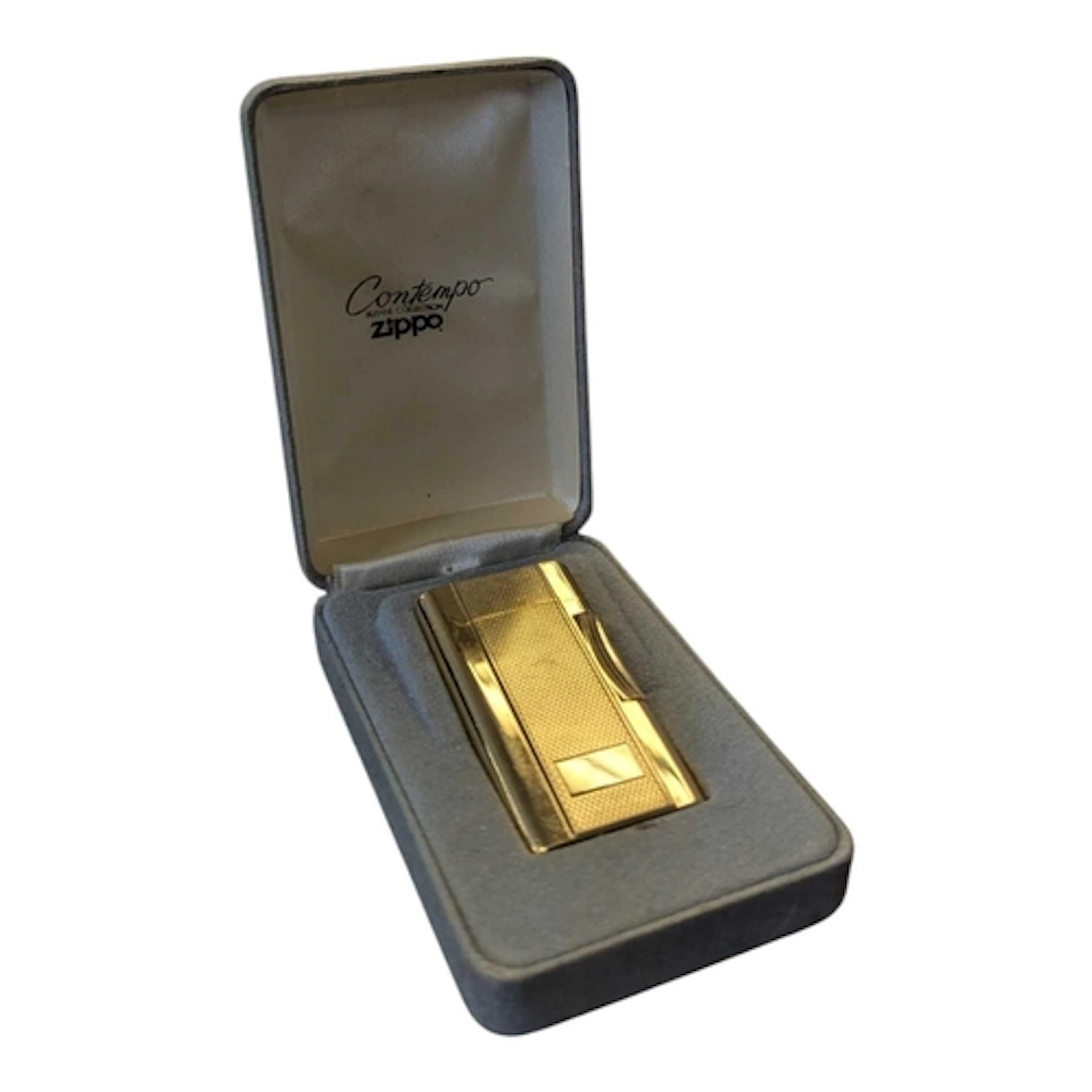 A vintage Zippo Contempo gold plated lighter. Featuring engi...