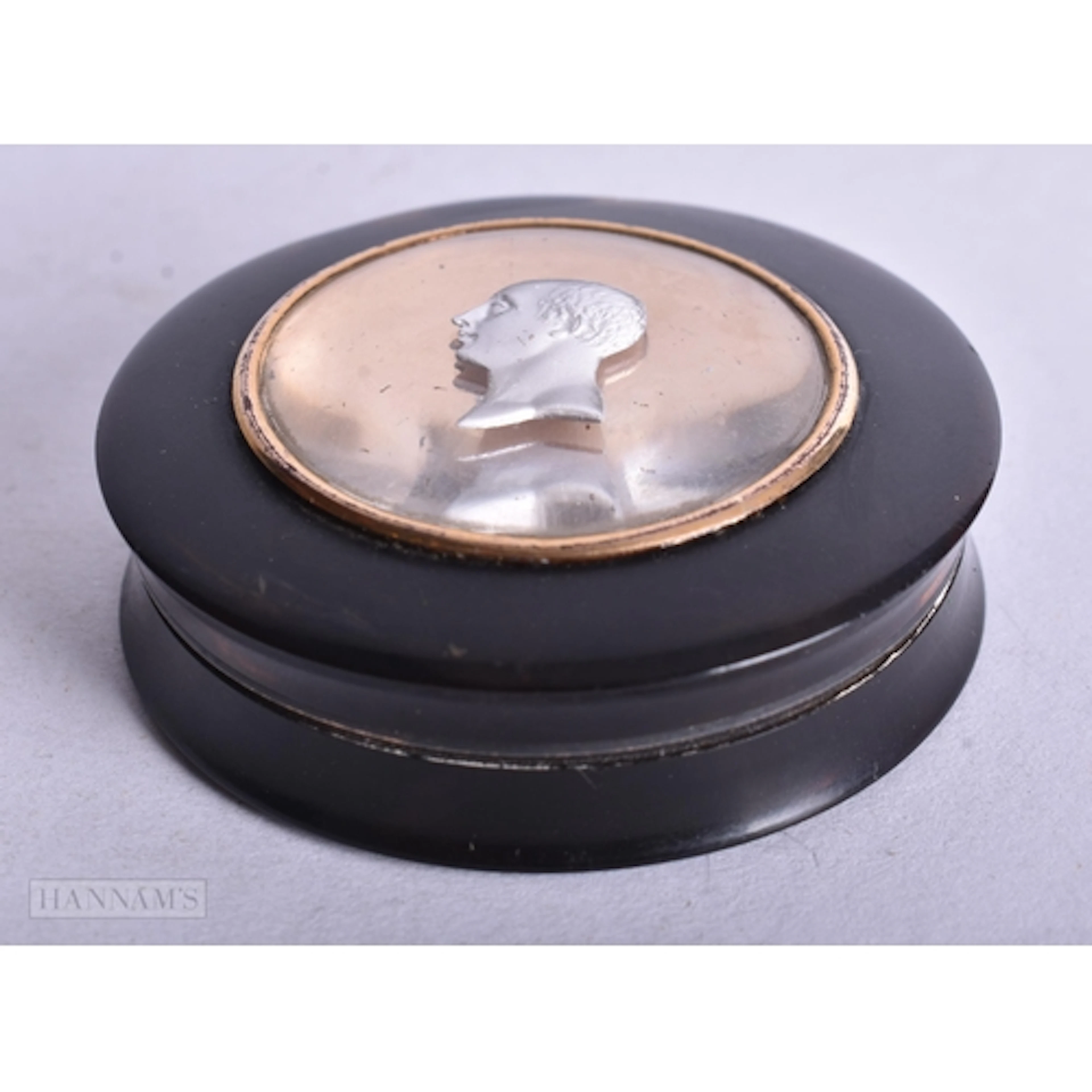 A George III TORTOISESHELL SILVER LINED PORTRAIT SNUFF BOX. ...