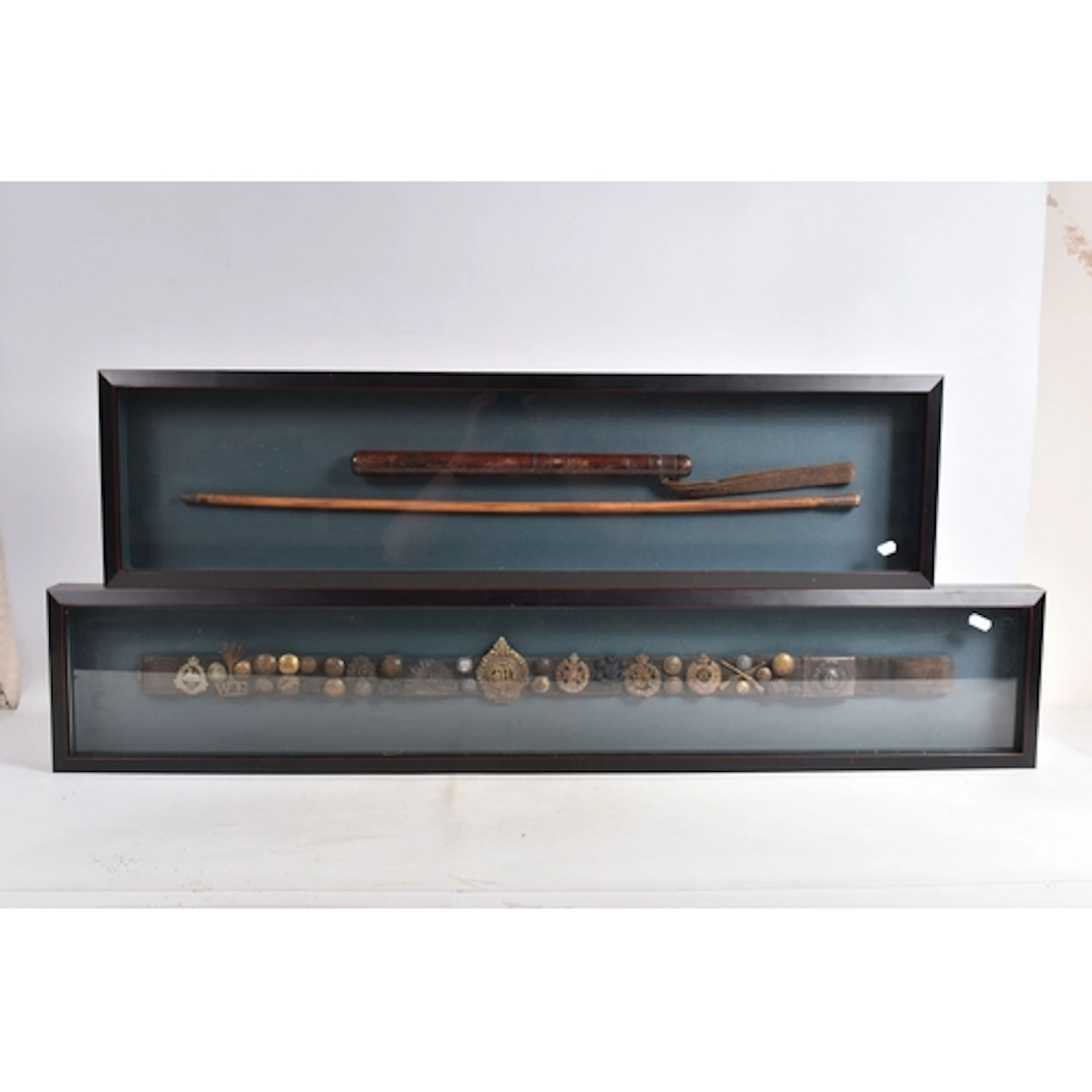 TWO FRAMED DISPLAYS OF MILITARY INTEREST, the first frame fe...