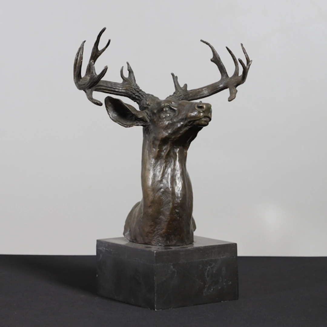 A 20TH CENTURY BRONZE OF A STAG'S HEAD. the antler's with 16...