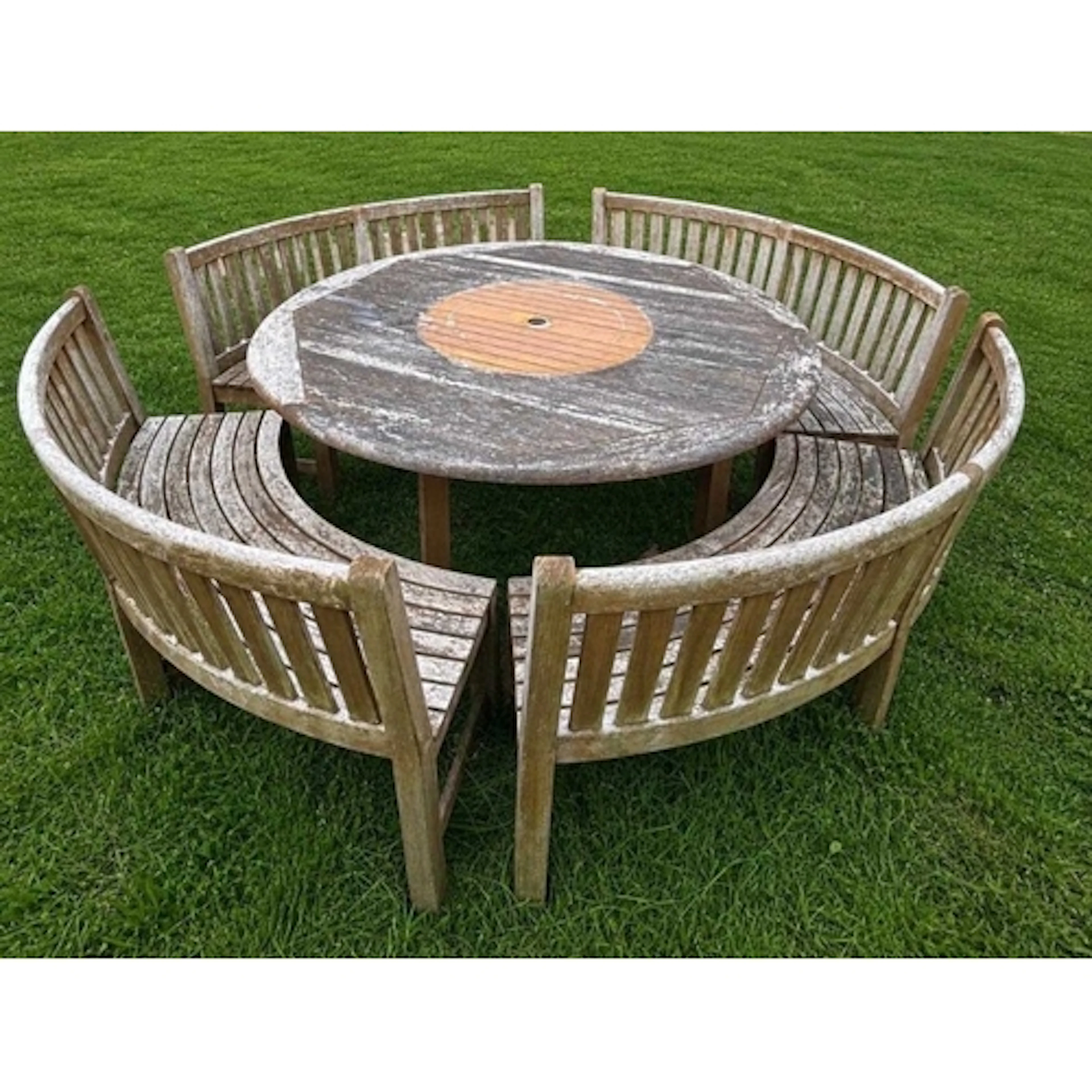 A weathered Westminster garden furniture set features a larg...