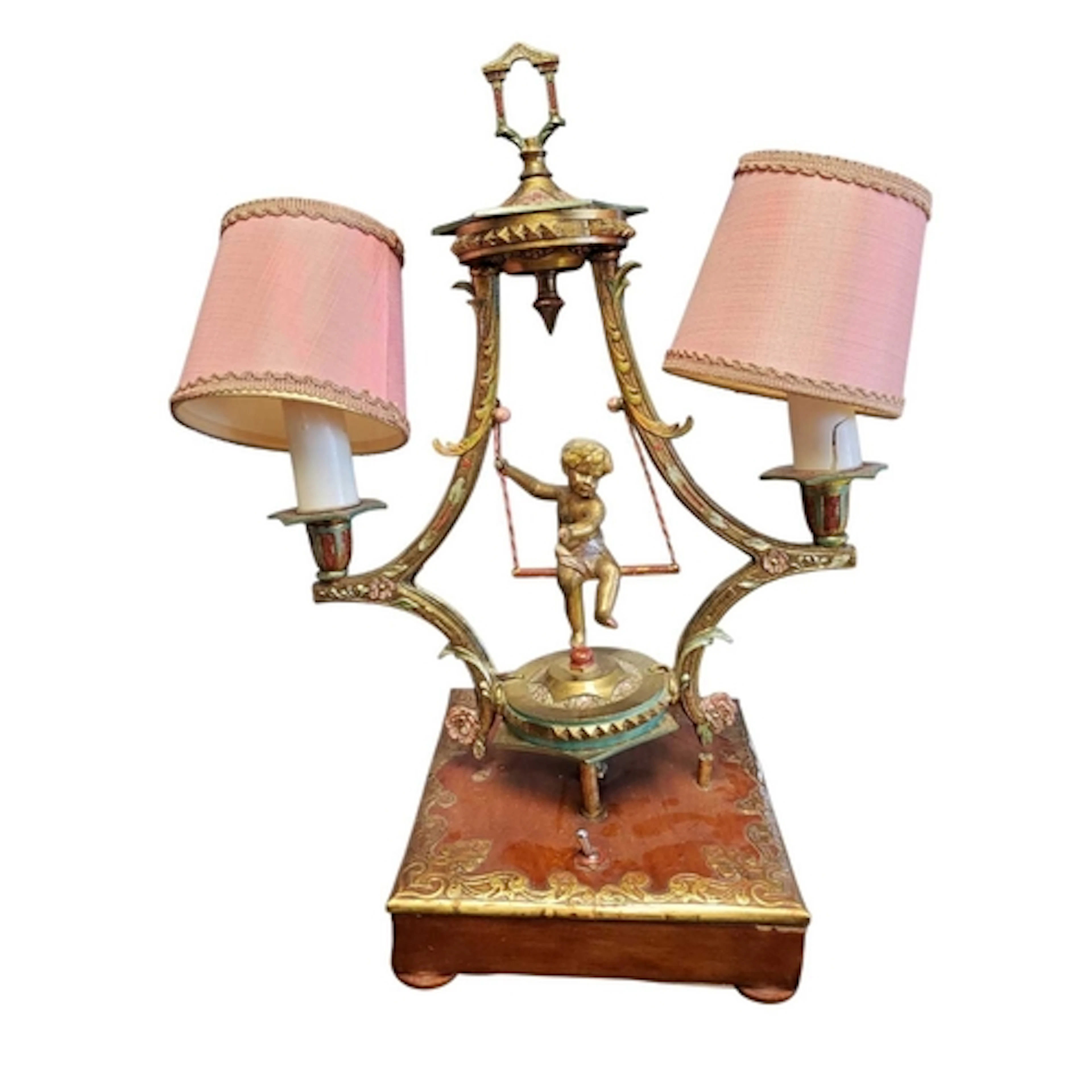 A 1950s twin branch metal cherub table lamp. The central che...