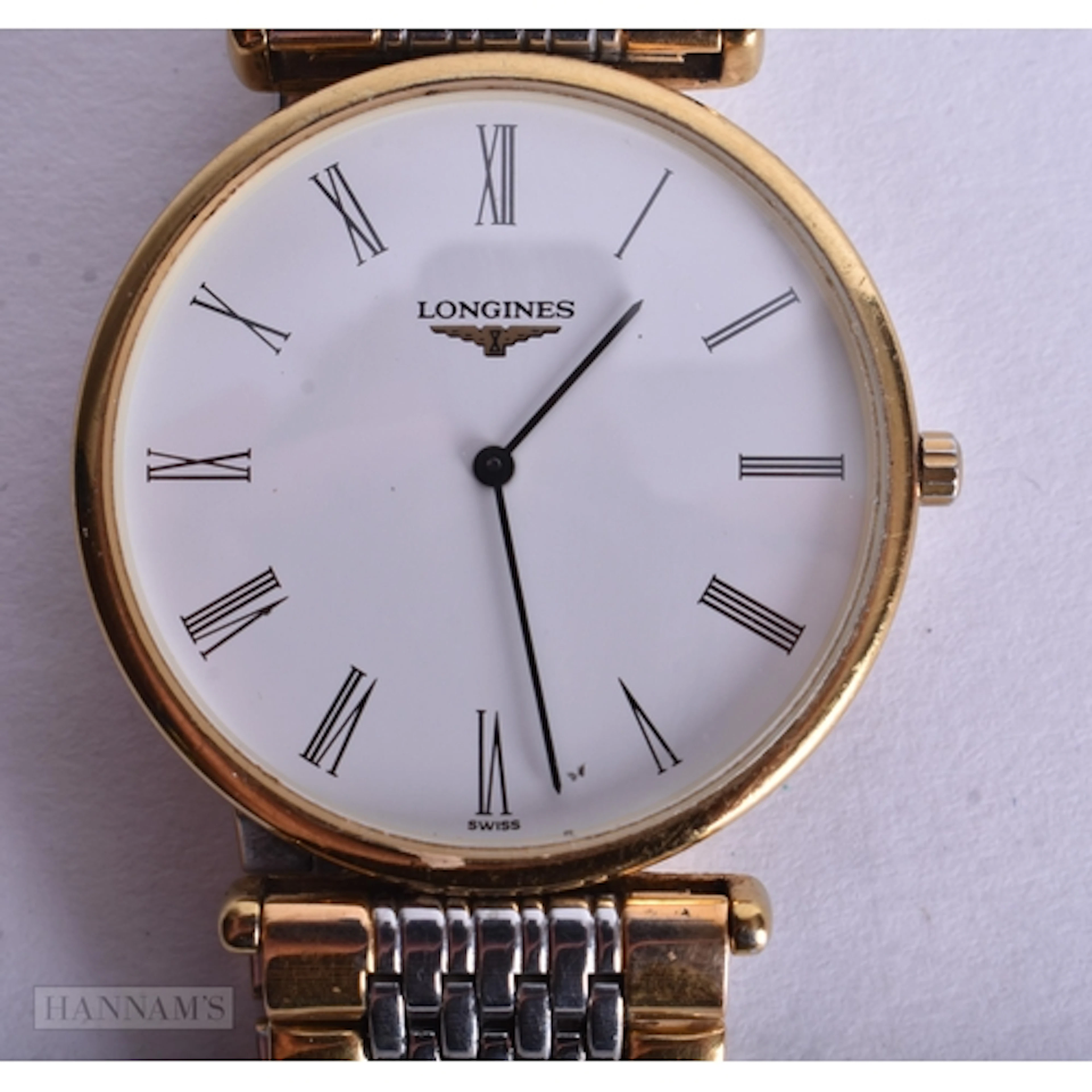 A LONGINES WRIST WATCH. Untested. 3 cm wide.
