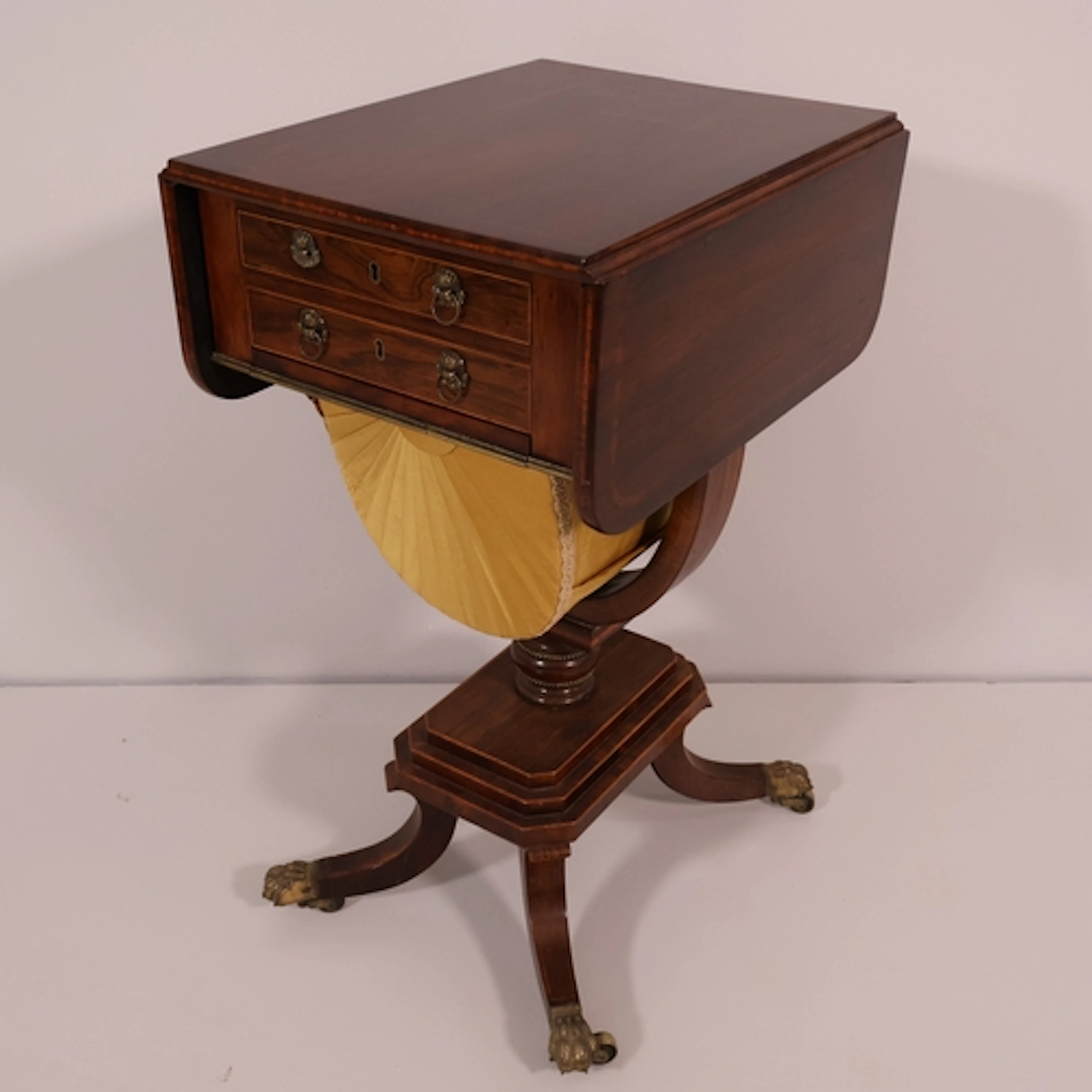 A George IV rosewood drop-leaf sewing table, with two drawer...