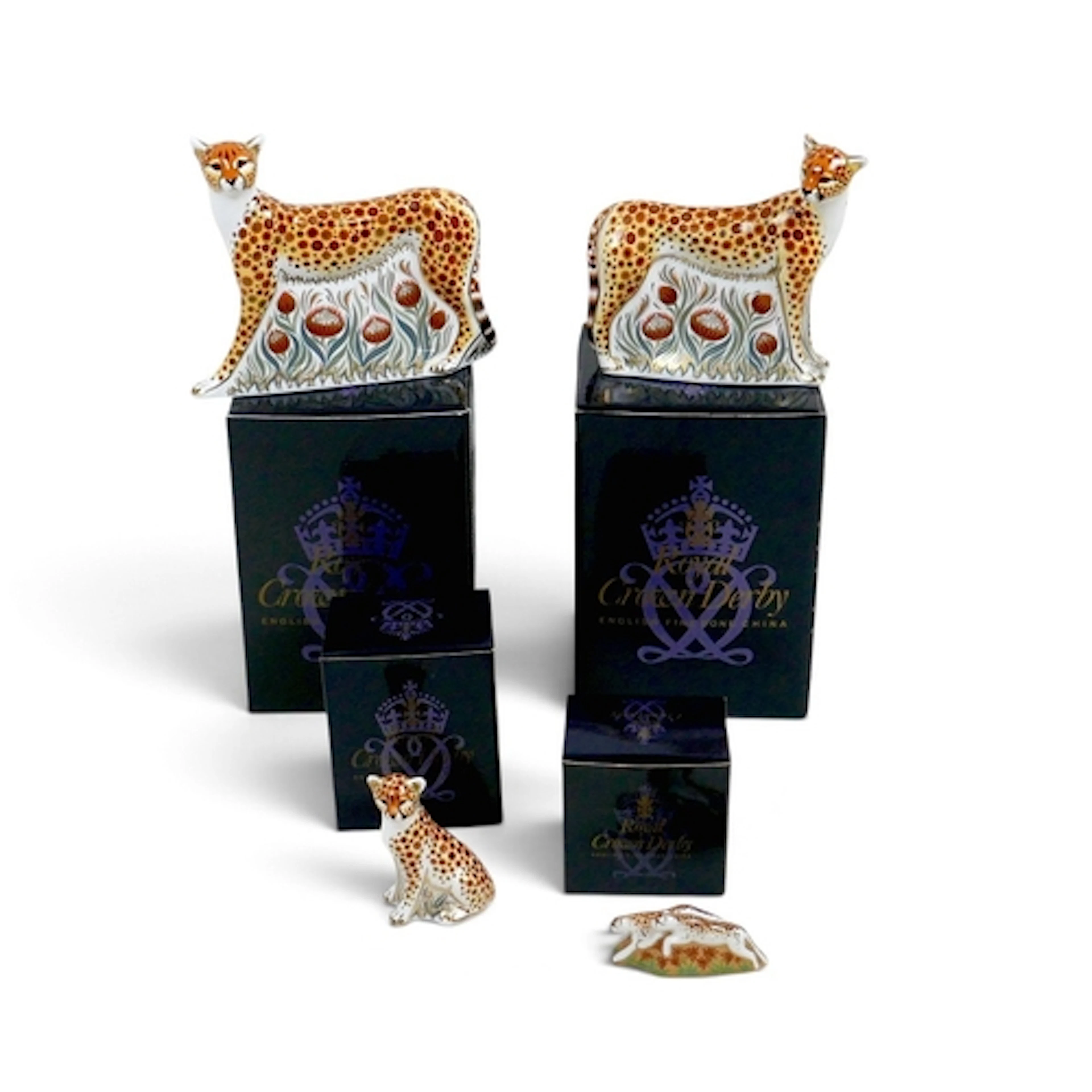 FOUR ROYAL CROWN DERBY CHEETAH PAPERWEIGHTS. comprising a Da...