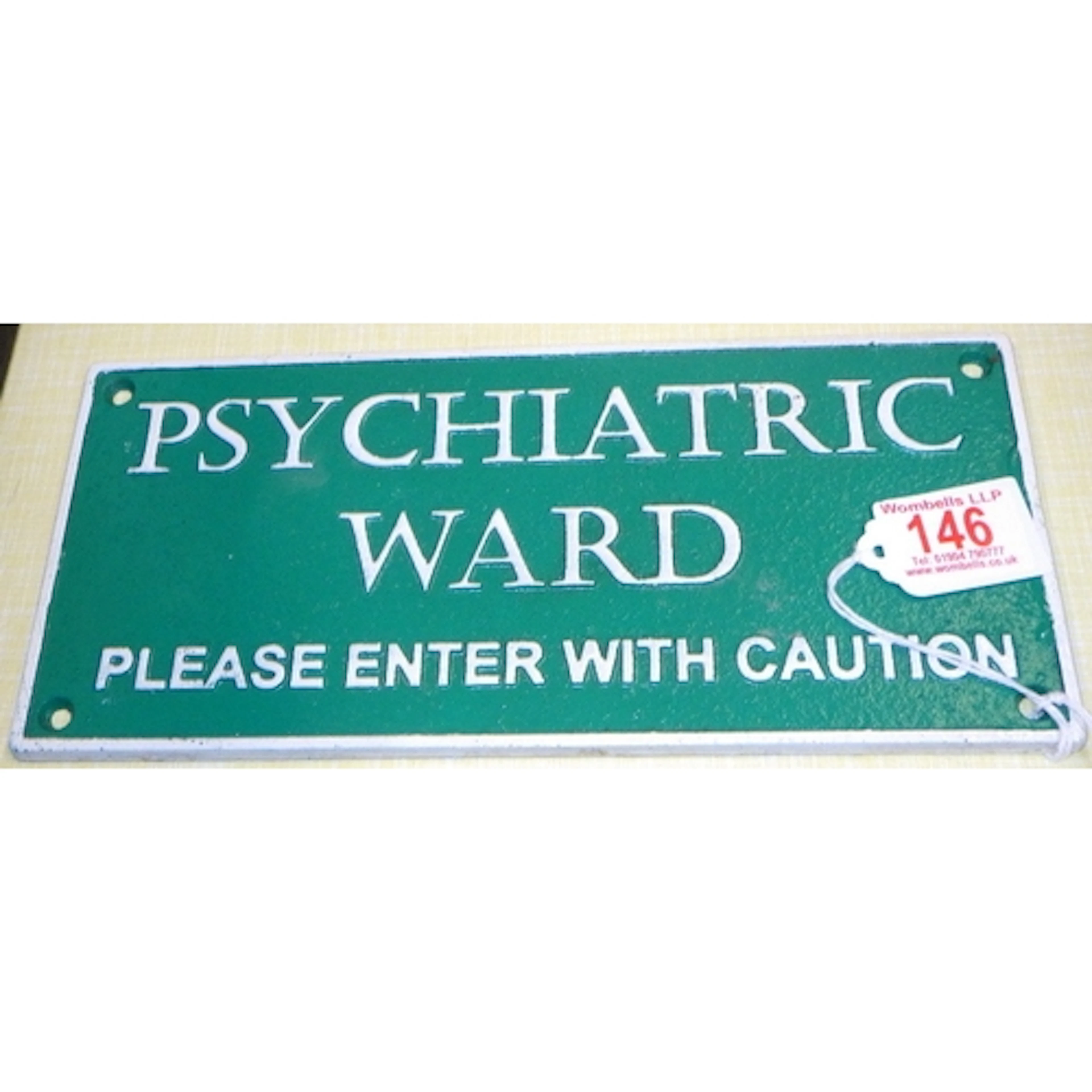 A cast Psychiatric Ward sign