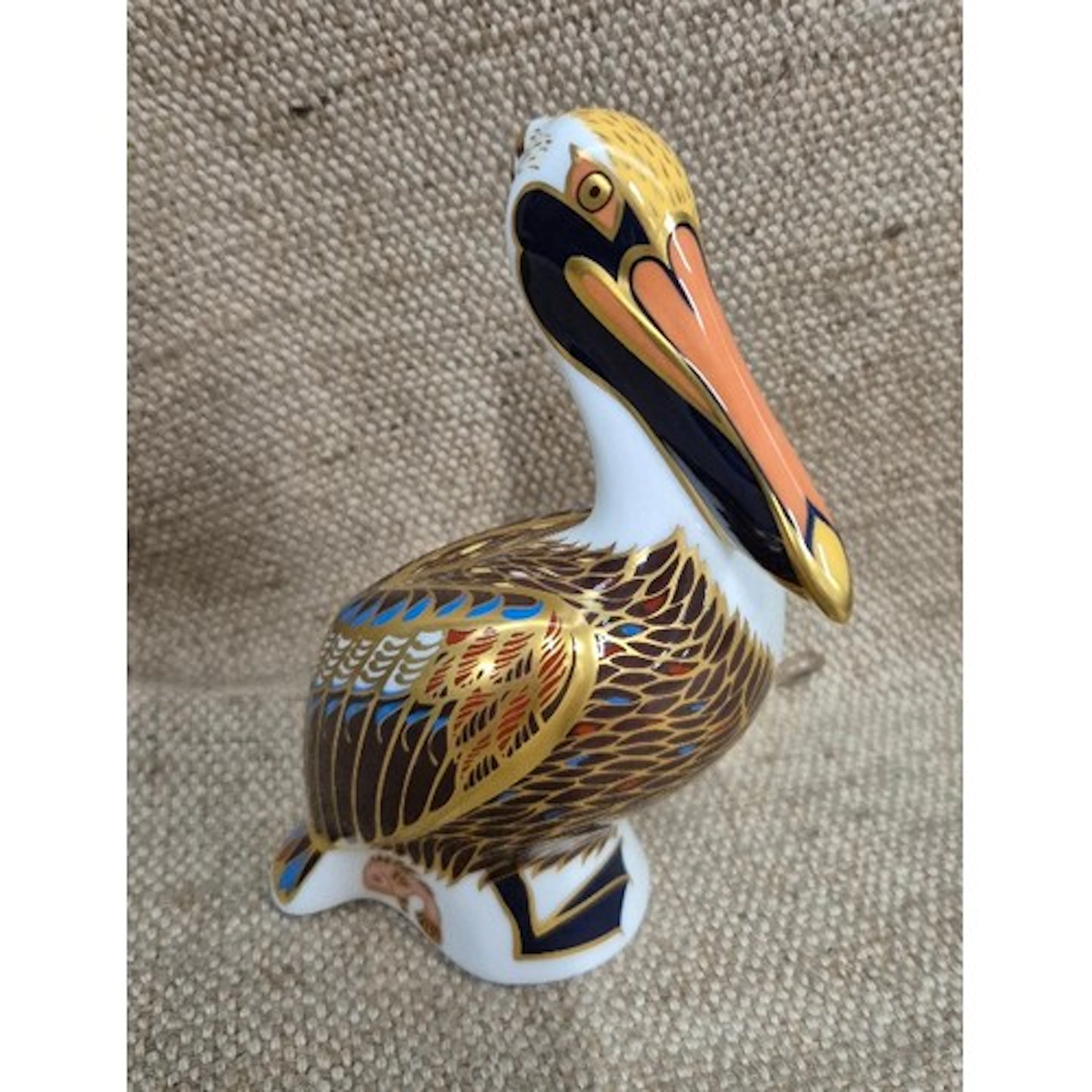 Royal Crown Derby Brown Pelican paperweight, gold stopper