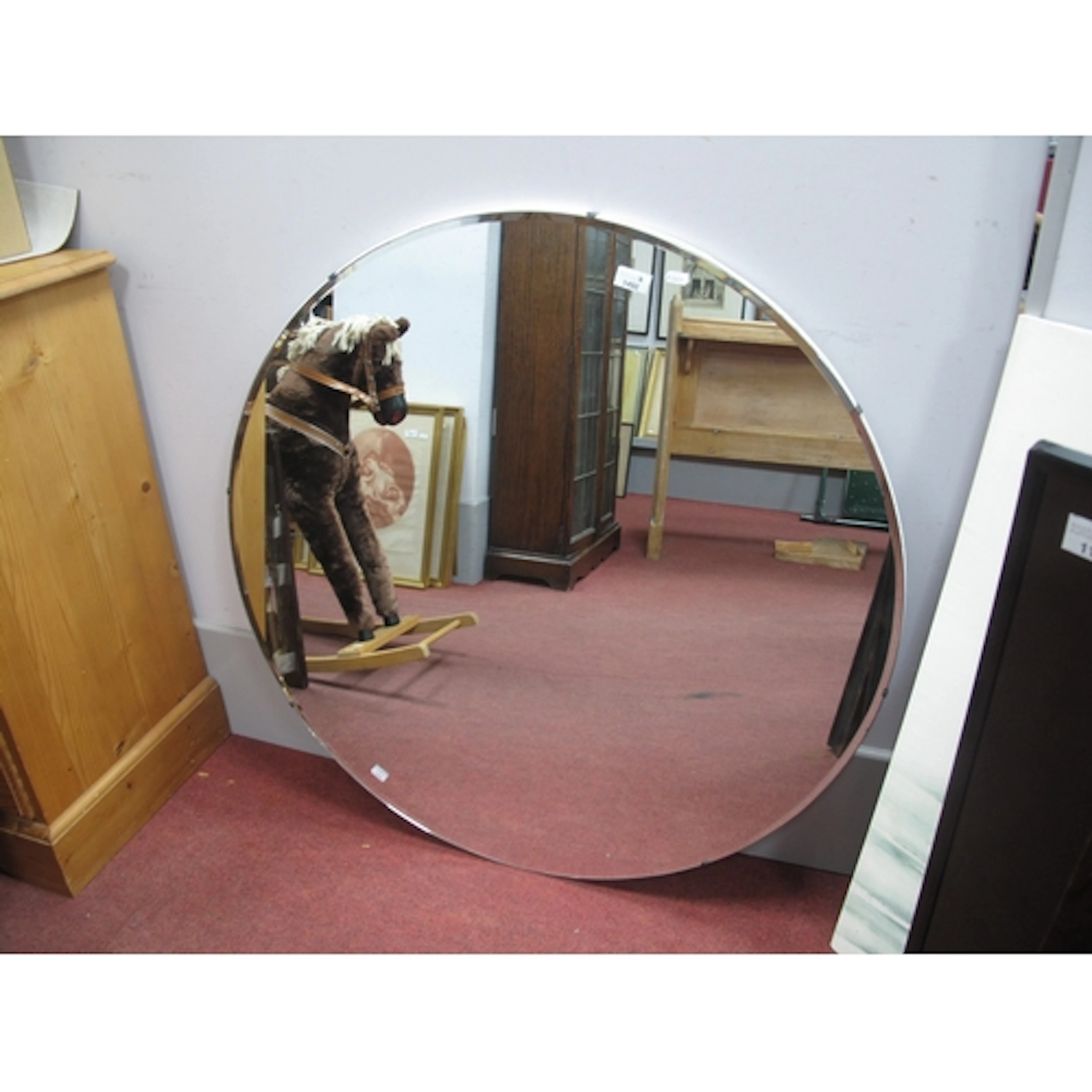 A Large Circular Frameless Wall Mirror, with bevelled edge, ...