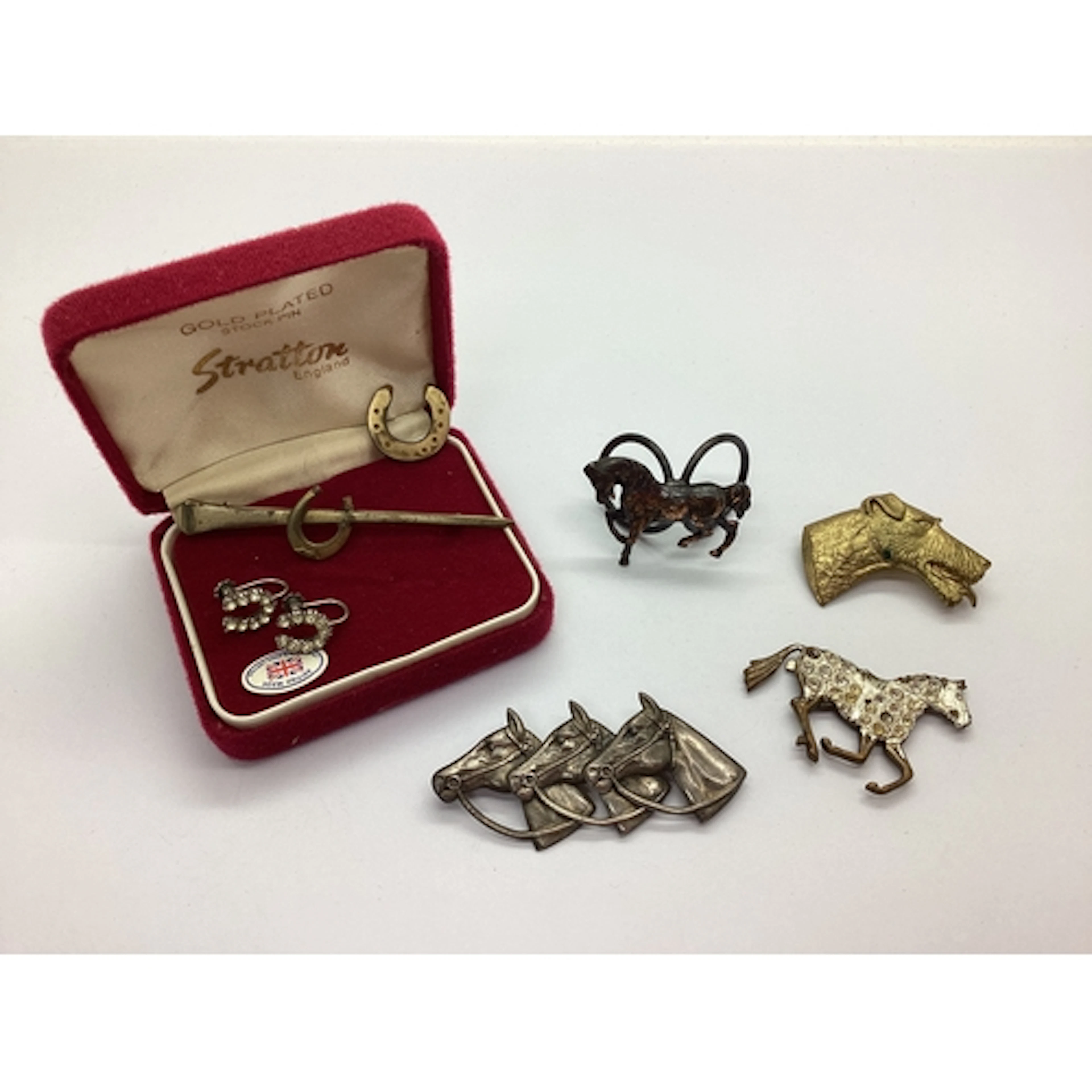 Equestrian Interest; A Triple Horse Head Brooch, of naturali...