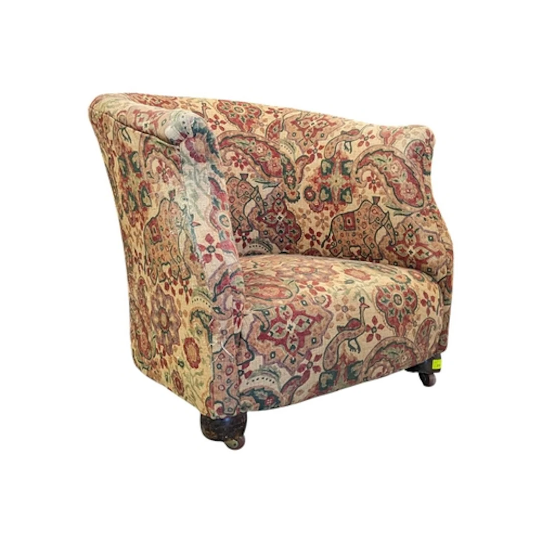 An early 20th century tub armchair. The chair of barrel form...