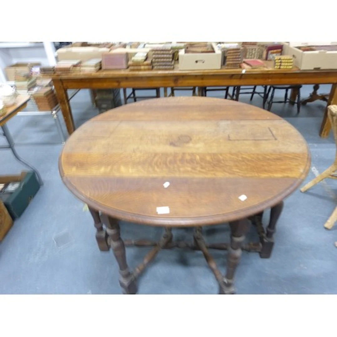 Antique oak double gate leg dining table with plank top.