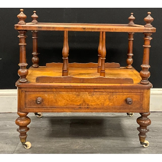 A Victorian Walnut Canterbury, four turned urn-shaped finial...