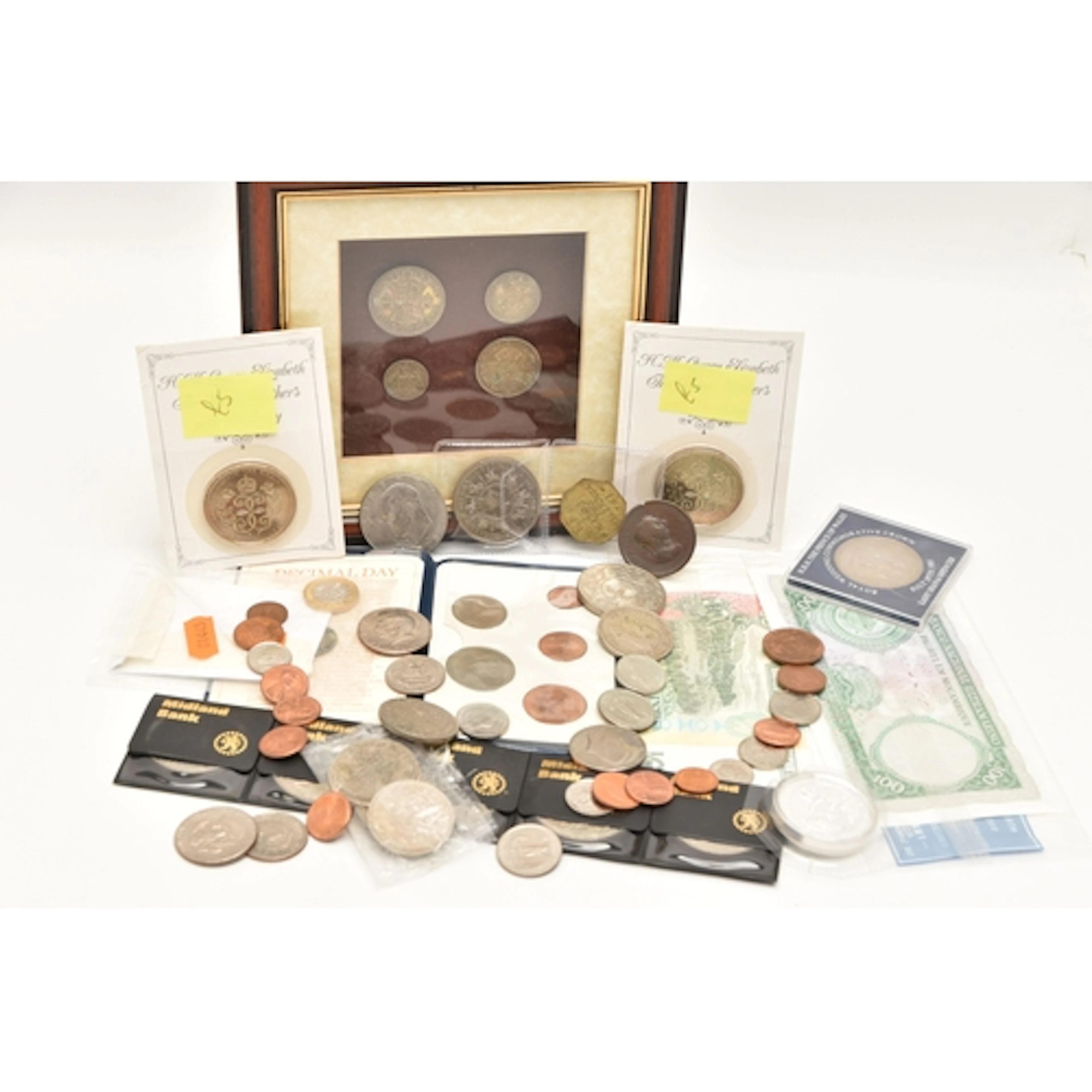 A CARDBOARD BOX CONTAINING COINS AND BANKNOTES, to include a...