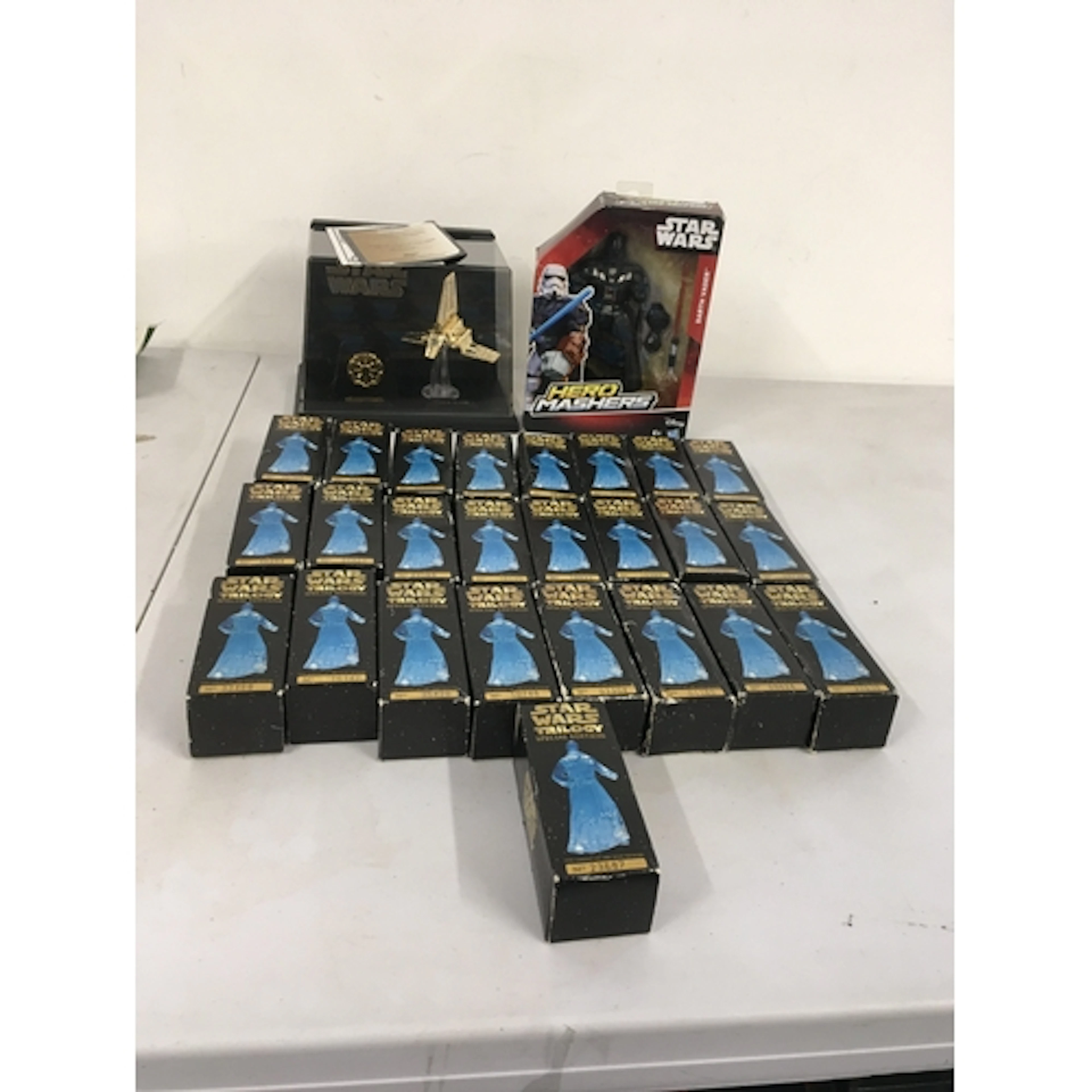 A collection of Star Wars models featuring 25 boxed numbered...