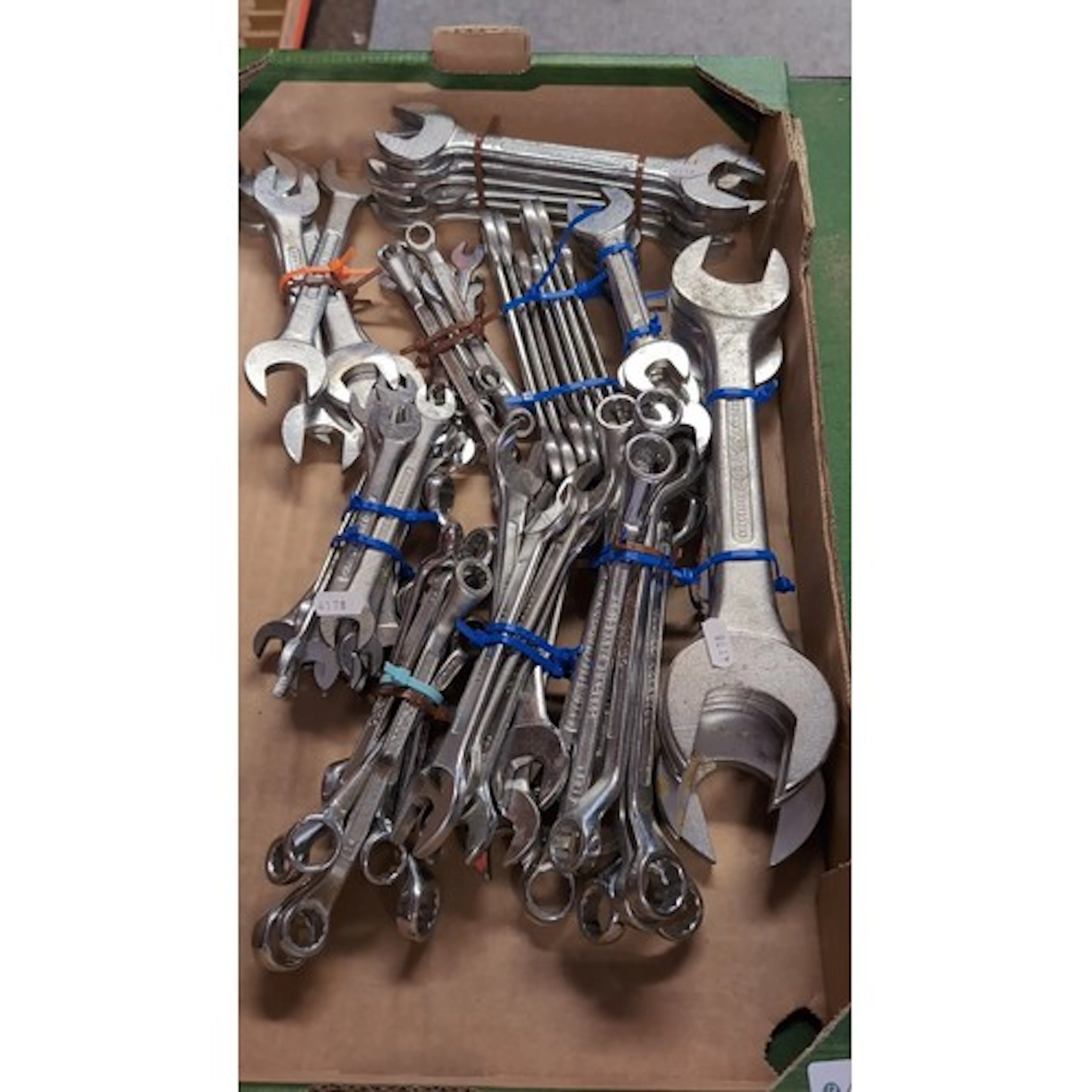 An assortment of steel spanners and combination wrenches, in...