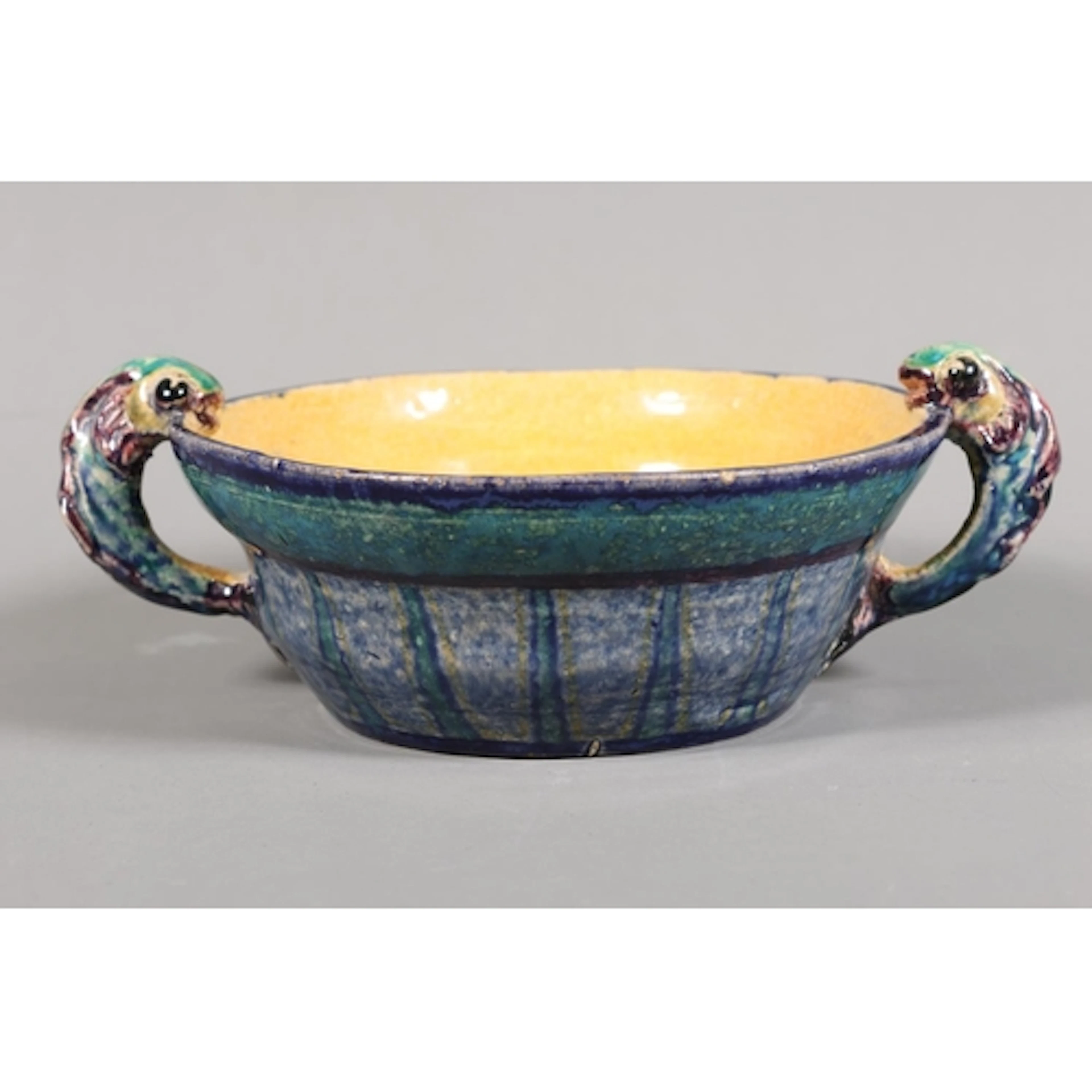 Studio twin-handled dish with yellow and blue glazed decorat...