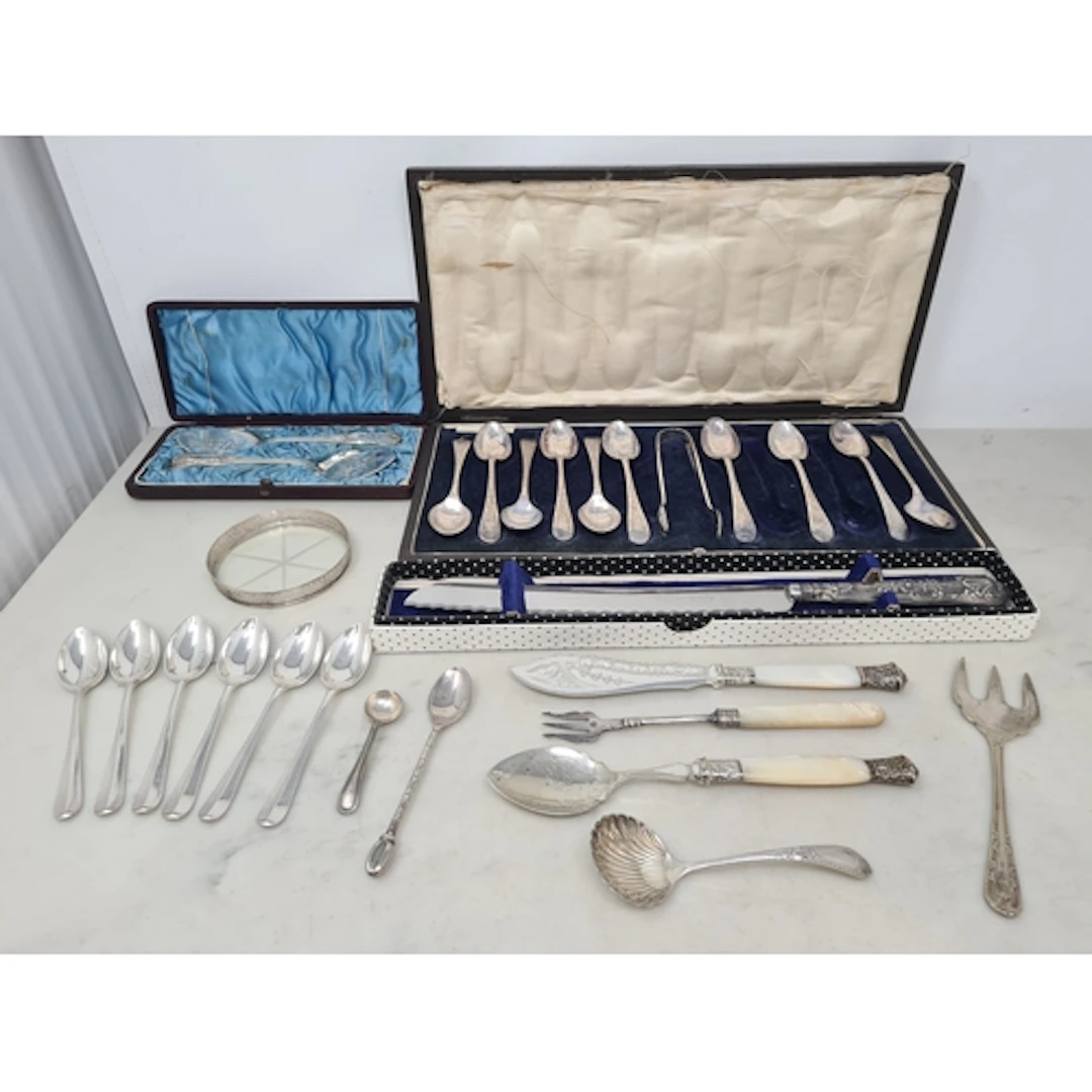 A silver handled Bread Knife, ten plated Teaspoons and sugar...