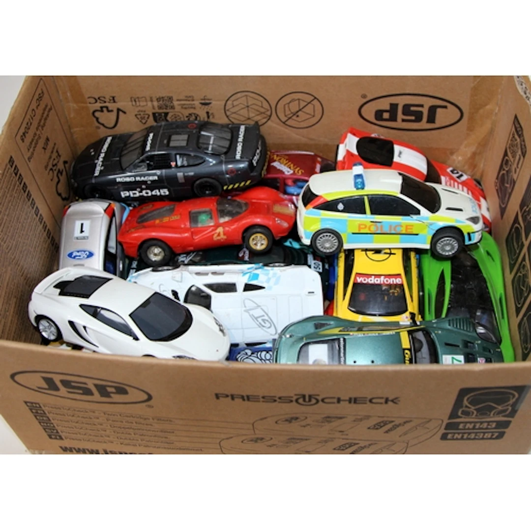 Vintage Scalextric: A carton containing a quantity of loose ...
