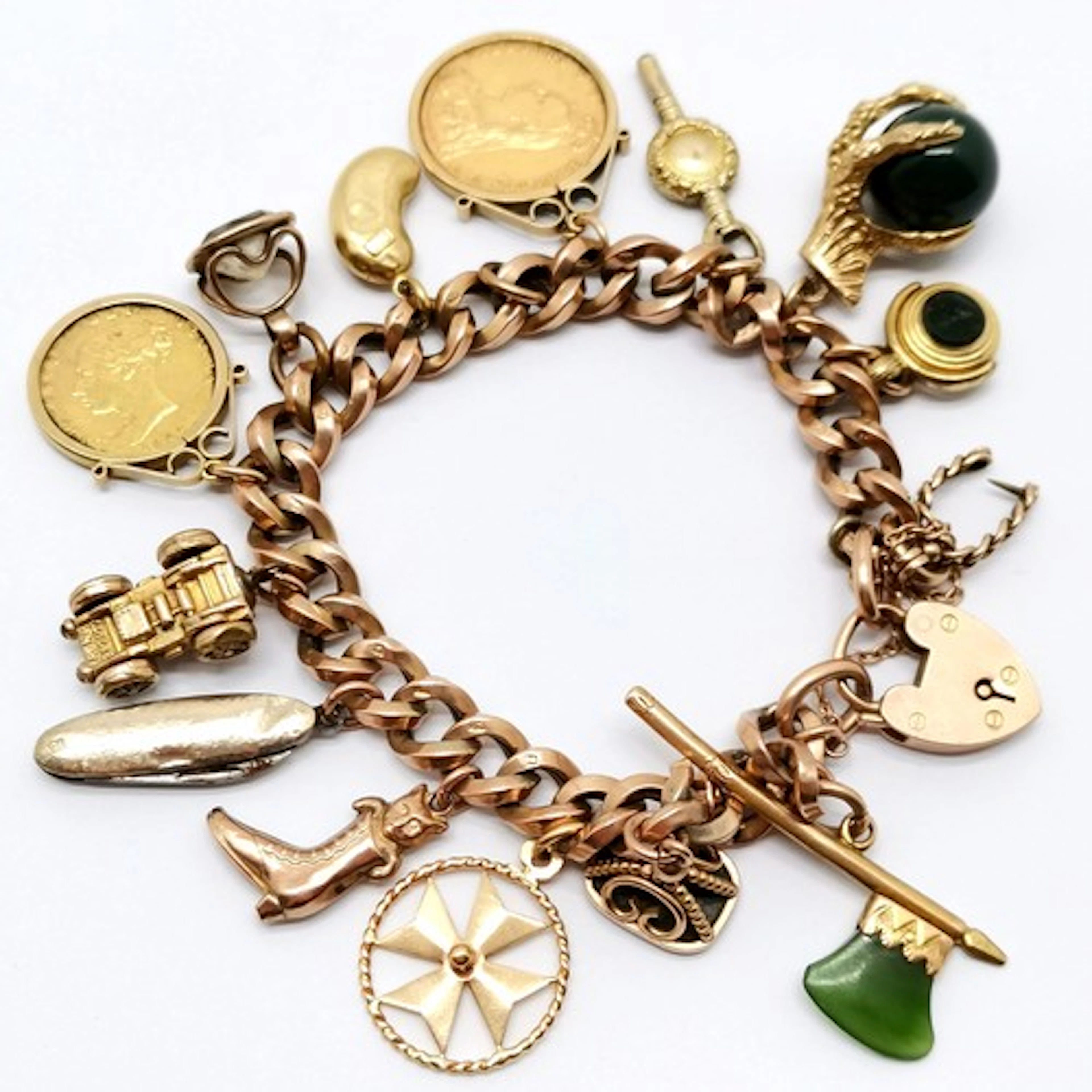 9ct gold charm bracelet with charms inc 1864 QV half soverei...