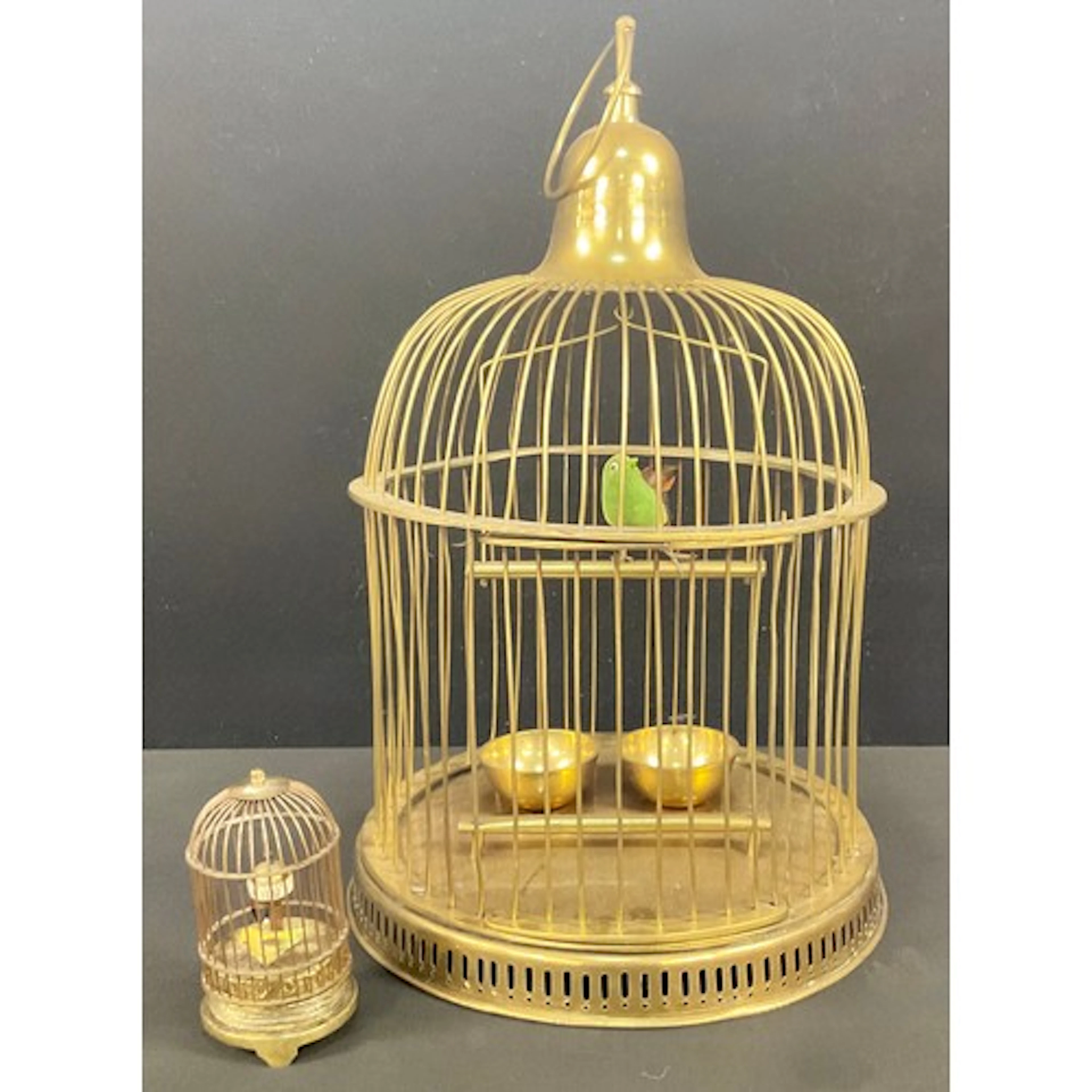 A novelty automaton clock, as a bird in a cage, 13cm high, 2...