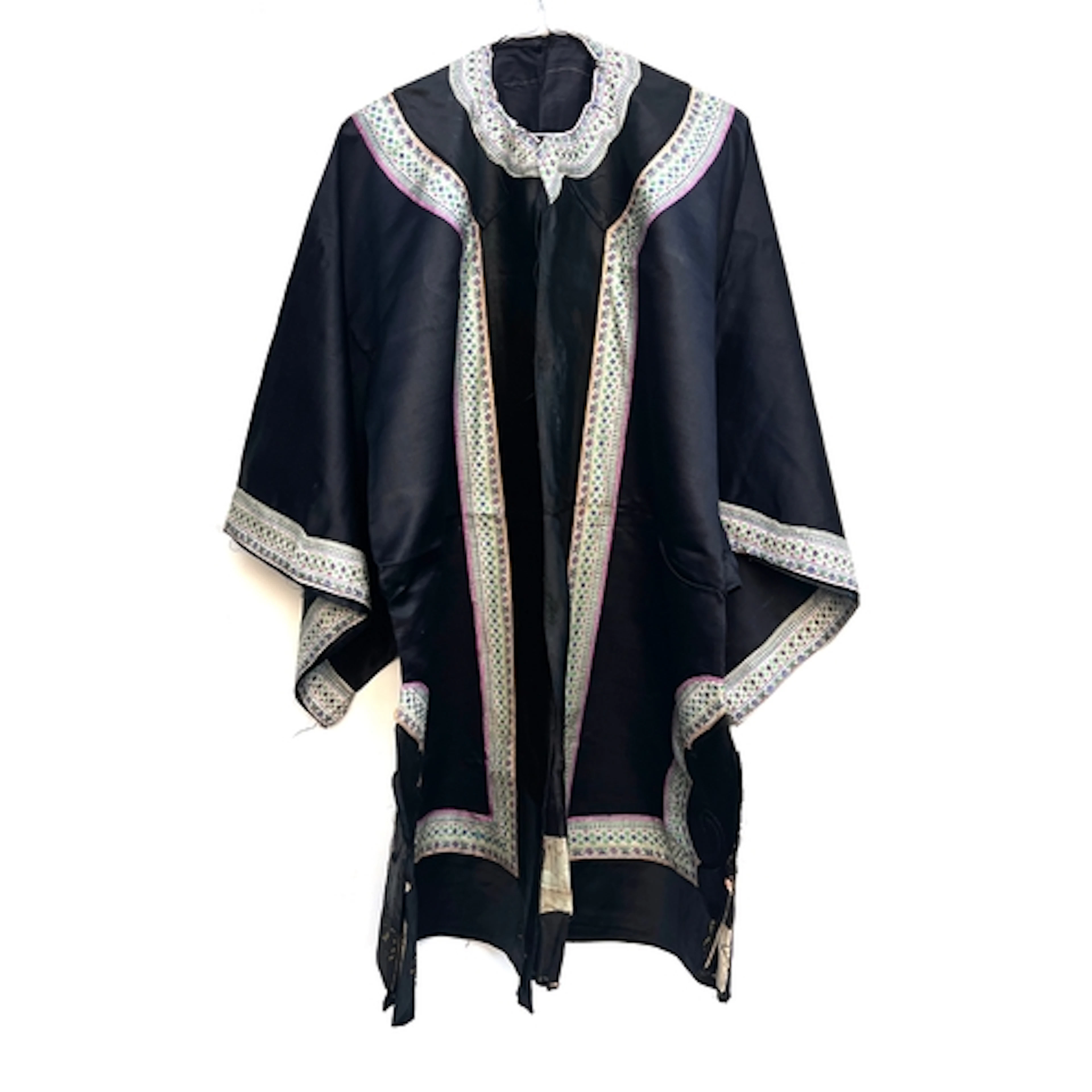 An antique Chinese black silk robe (unfinished), later press...