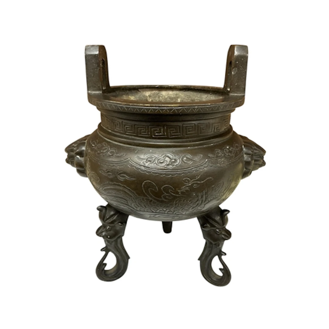 A Japanese bronze tripod censer with cast dragon body, heigh...