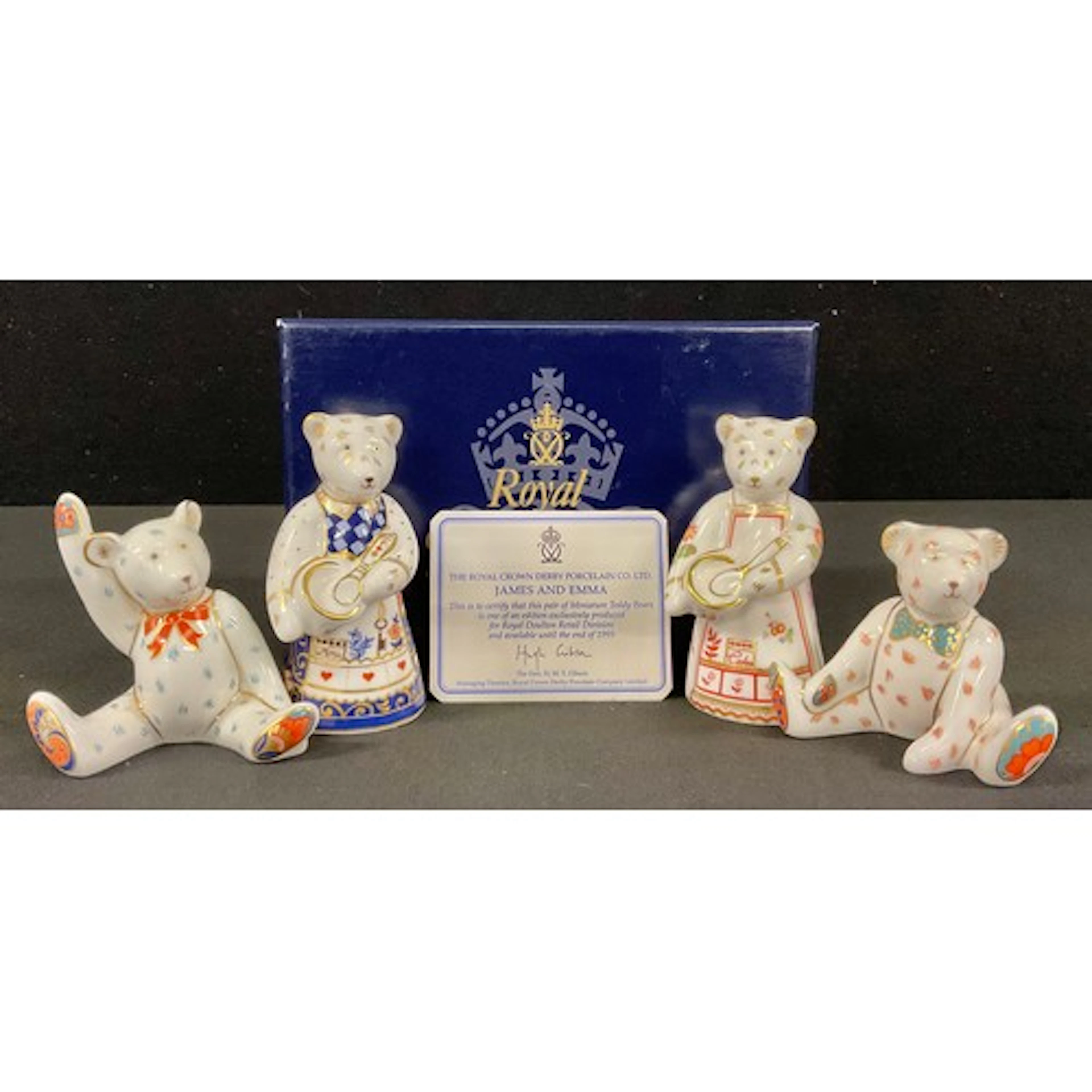 A pair of Royal Crown Derby miniature teddy bears, James and...