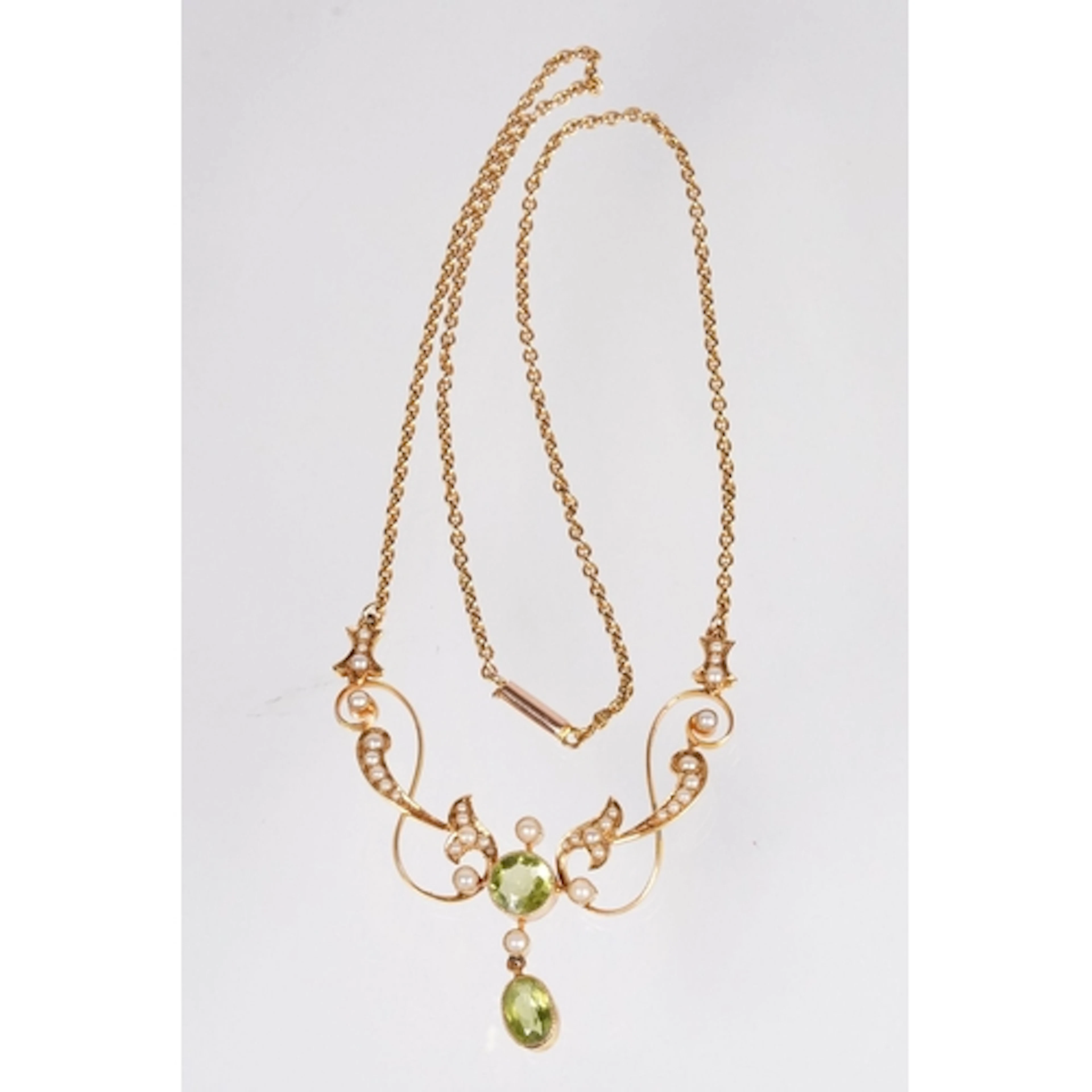 Edwardian 15ct gold, peridot and seed pearl necklace. The ne...