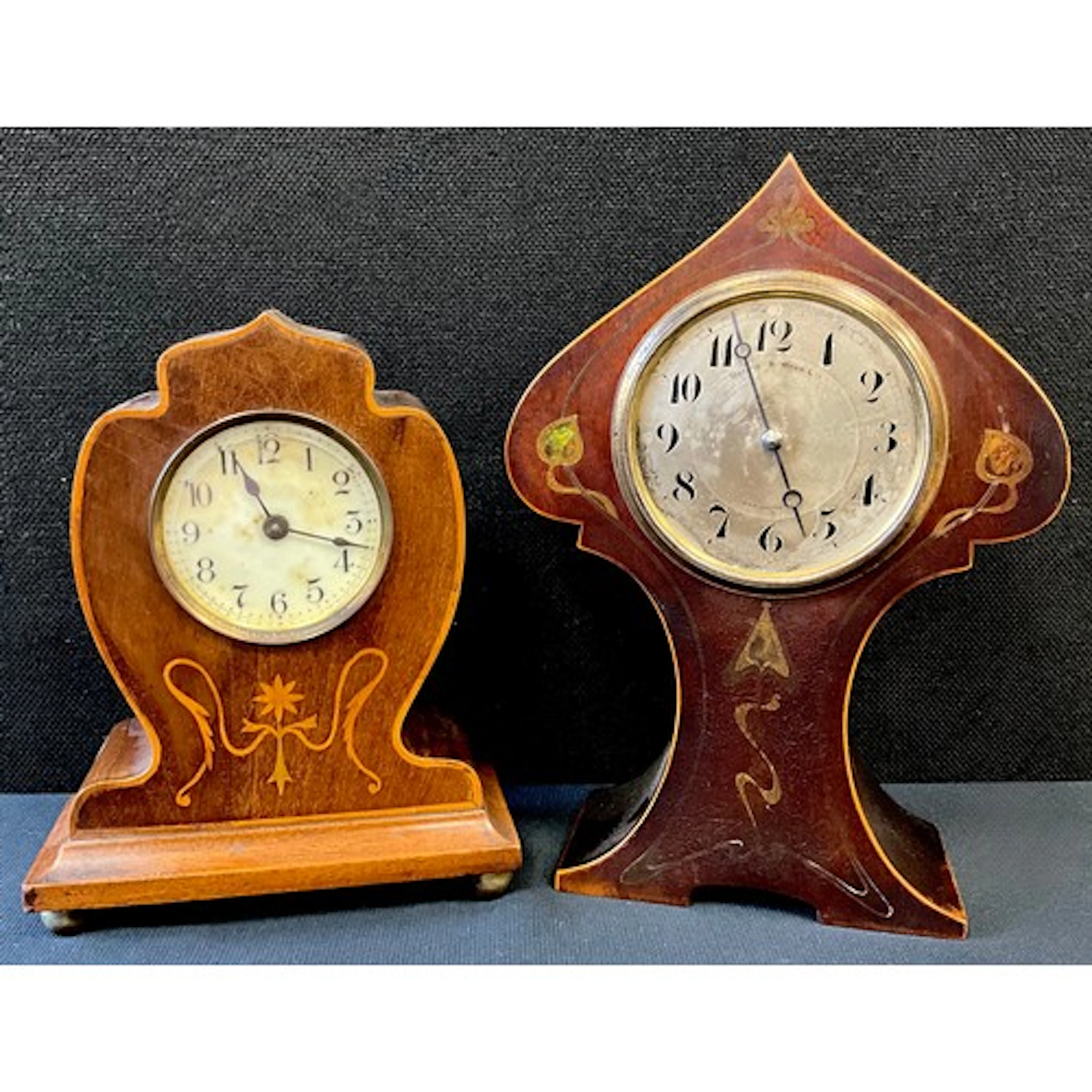 An Art Nouveau balloon clock, silver red dial, Arabic numera...