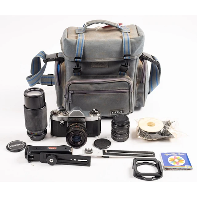 A Praktica 35mm camera outfit. Comprising a Praktica Super T...