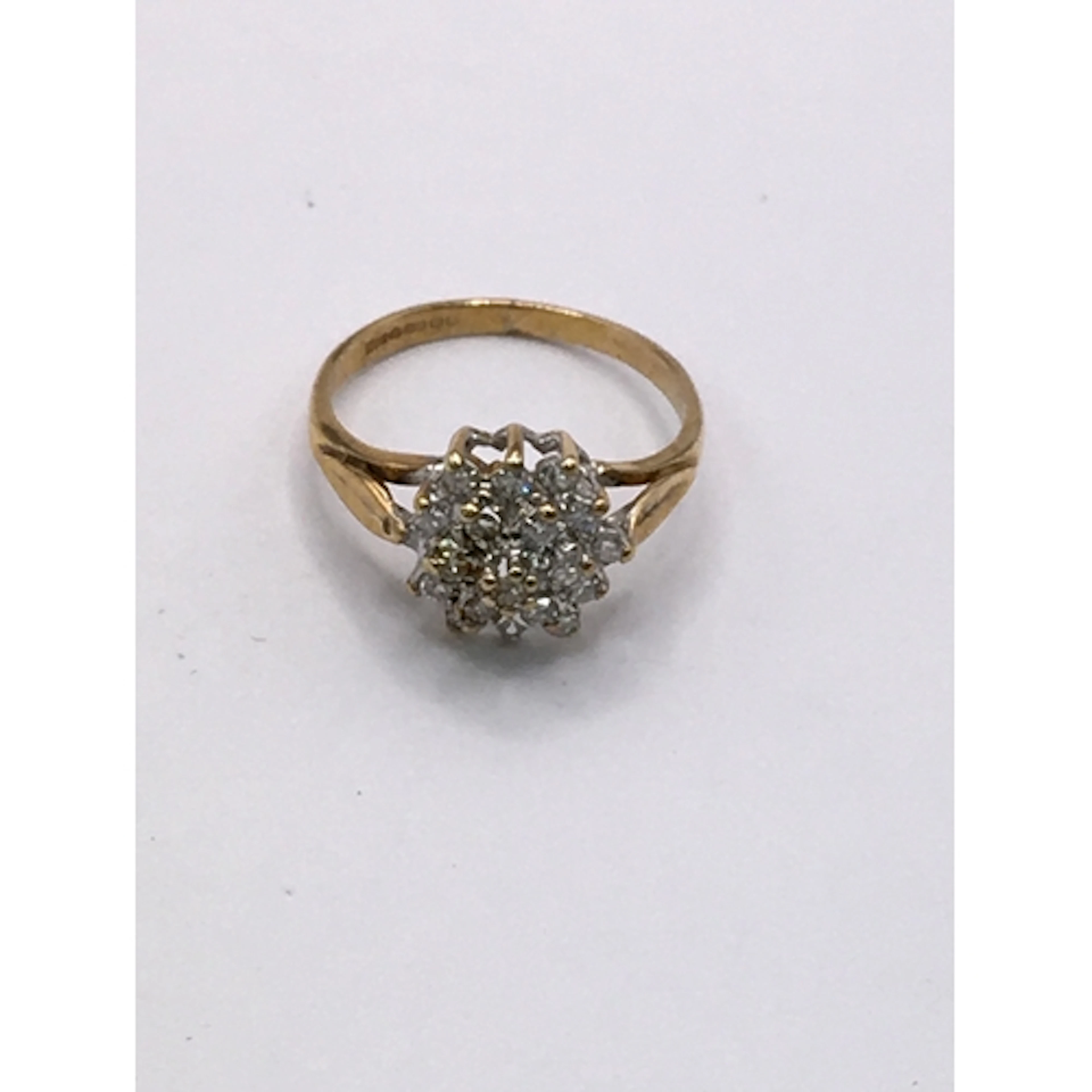 A 9ct gold cluster ring set with white stone. Approx H, smal...