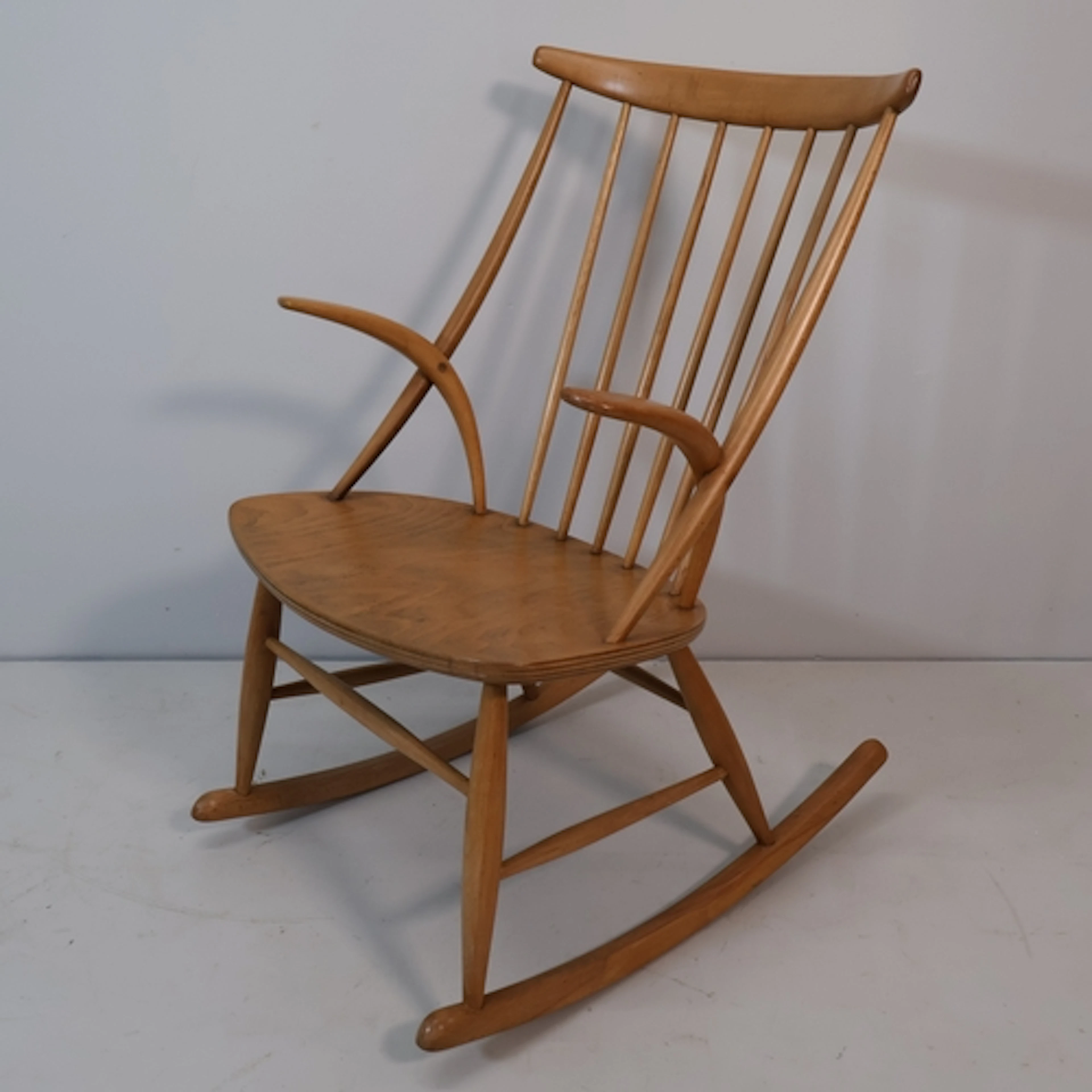 A mid century Danish IW3 rocking chair designed by Illum Wik...