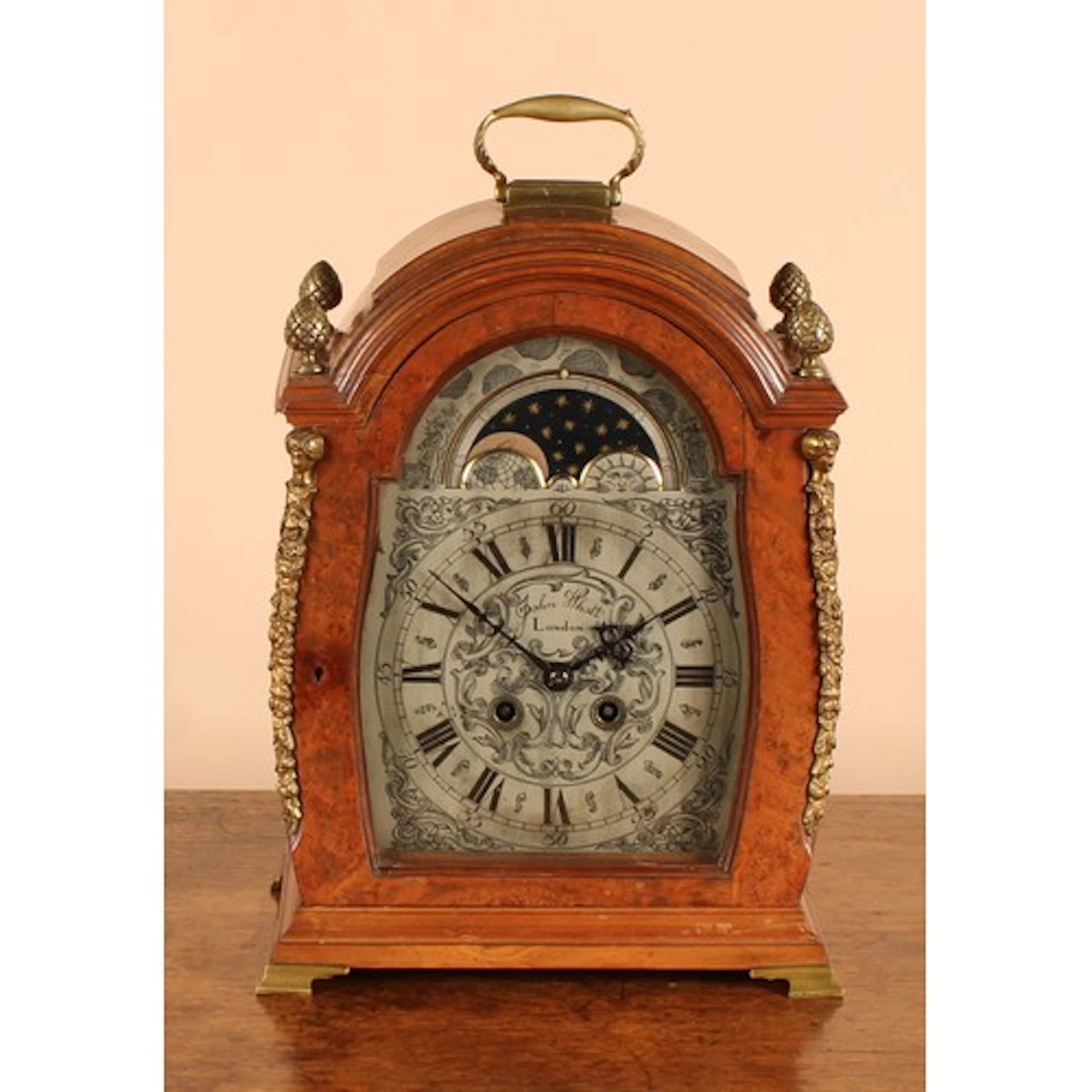 A George II Revival brass mounted walnut table or bracket cl...