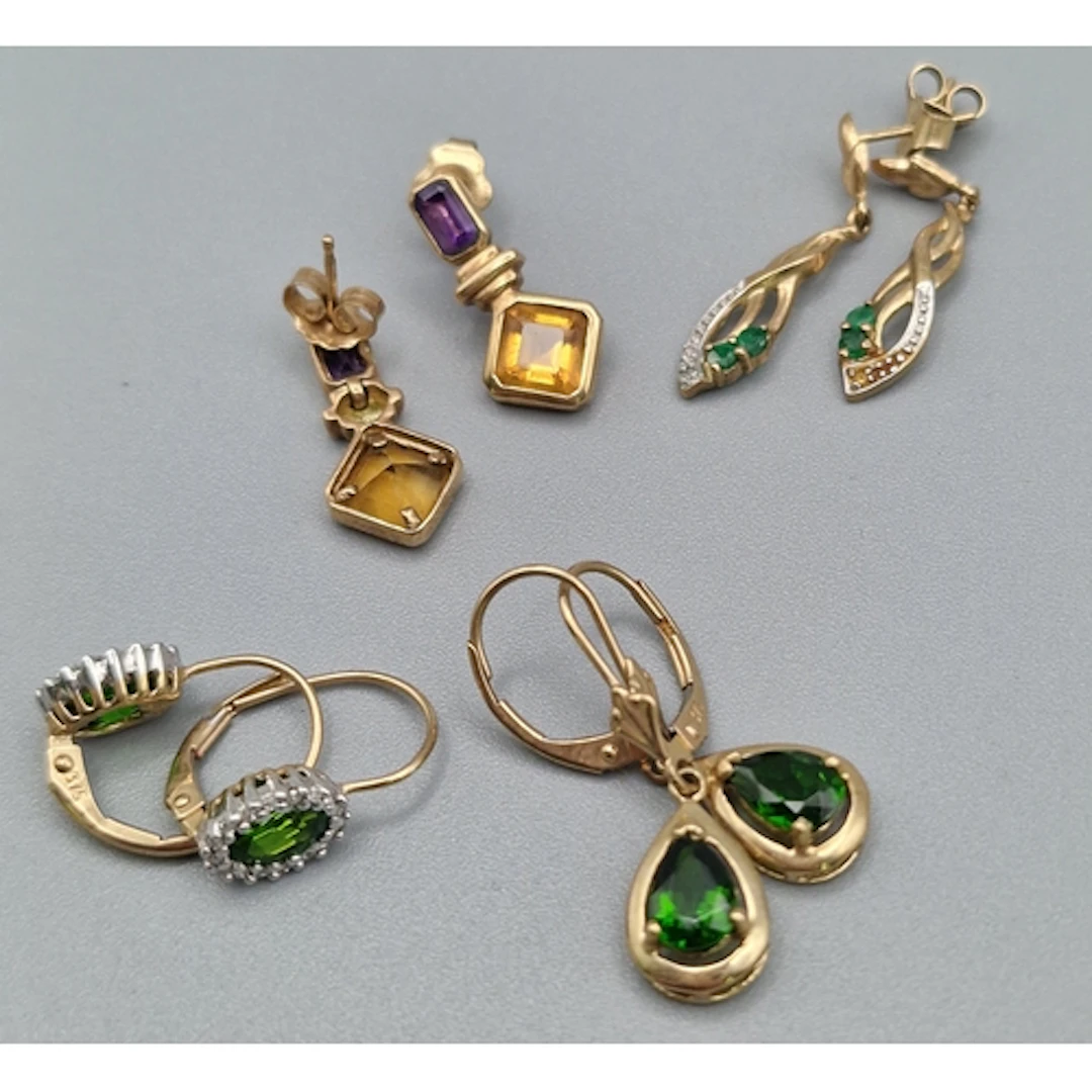 Four pairs of 9ct gold earrings set with semi-precious and o...