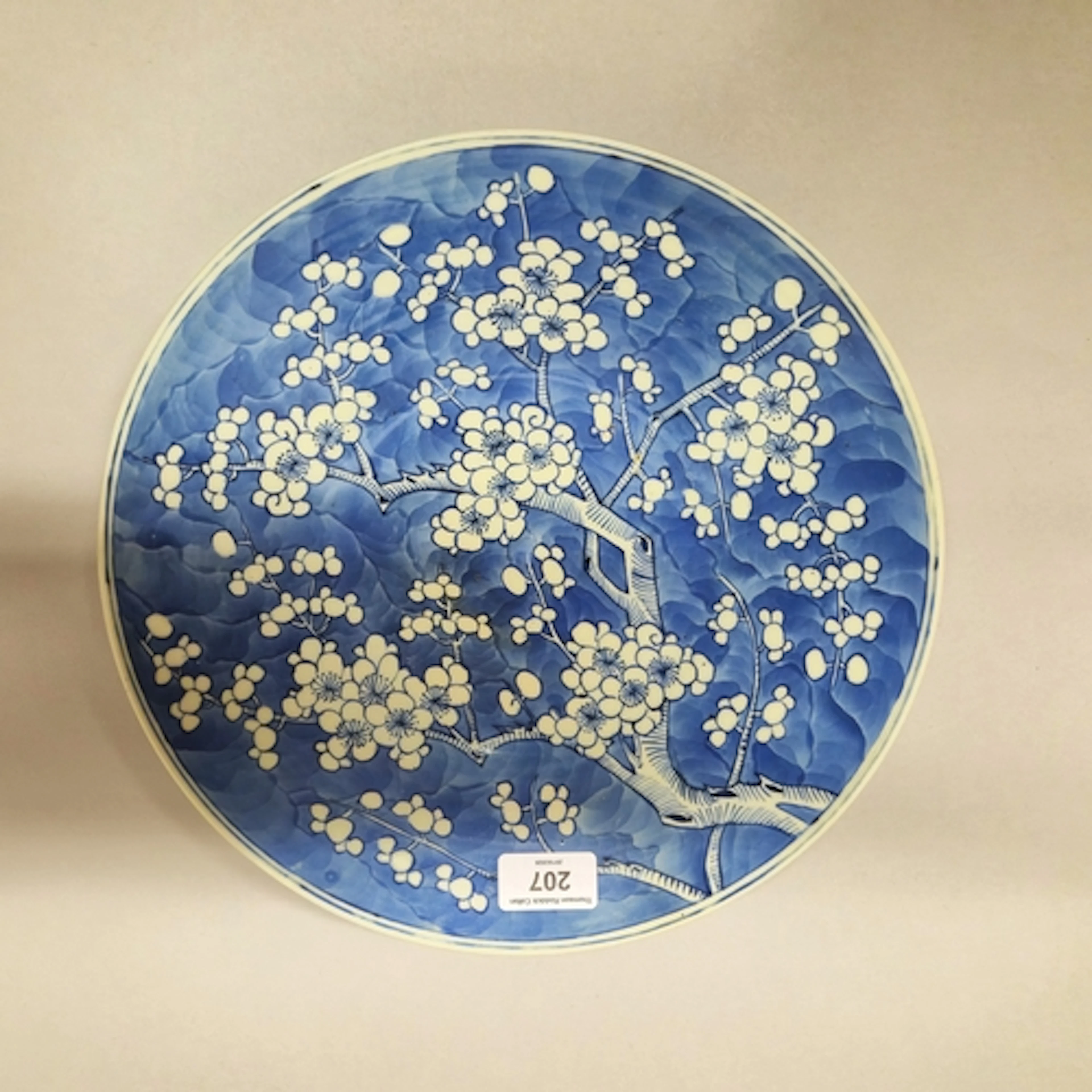 Japanese prunus dish on cracked ice blue ground, Meiji 1868-...