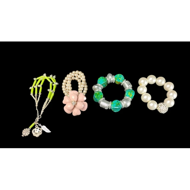 A group of four costume bracelets: green tubular beads with ...