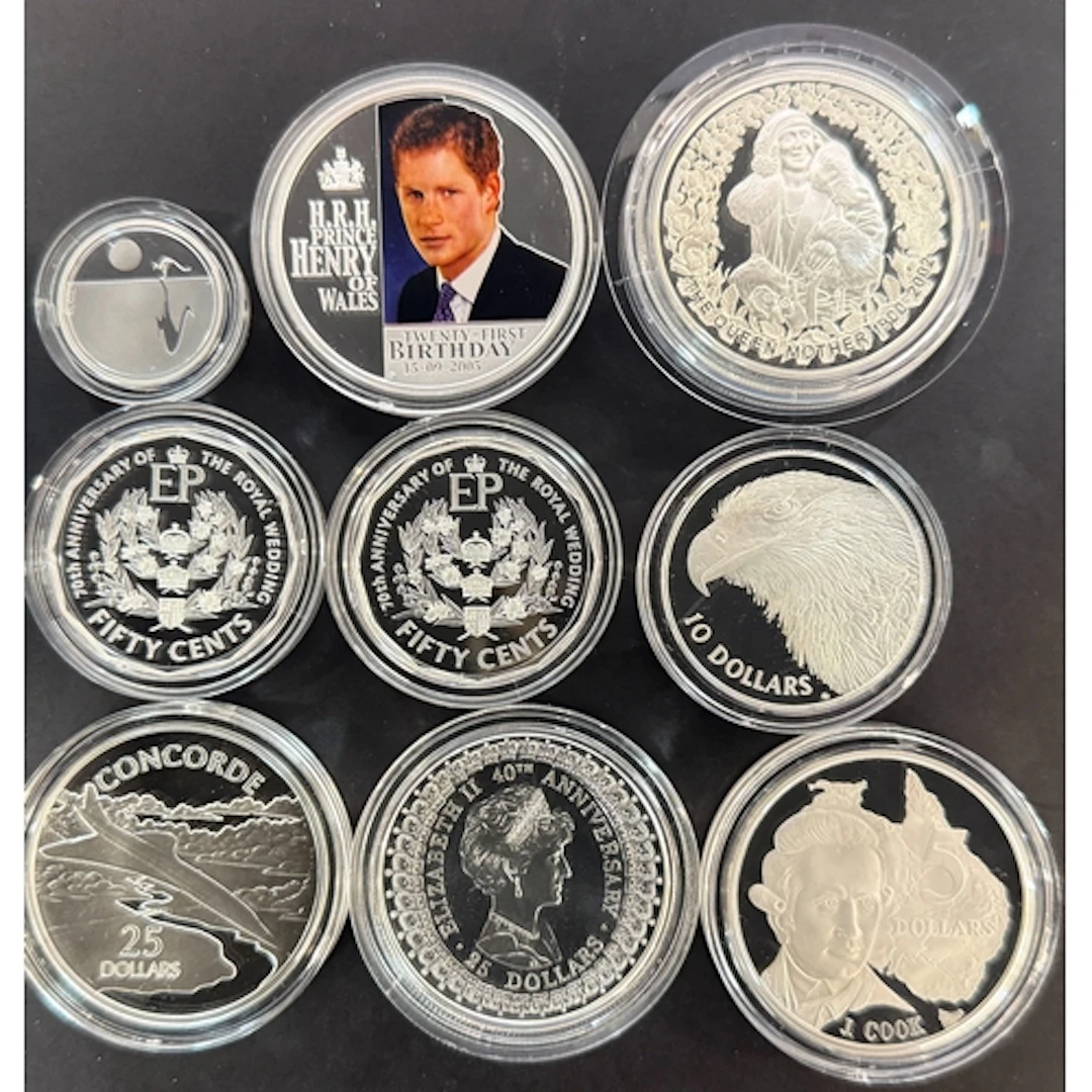 A group of nine Australian and Solomon Islands silver coins,...