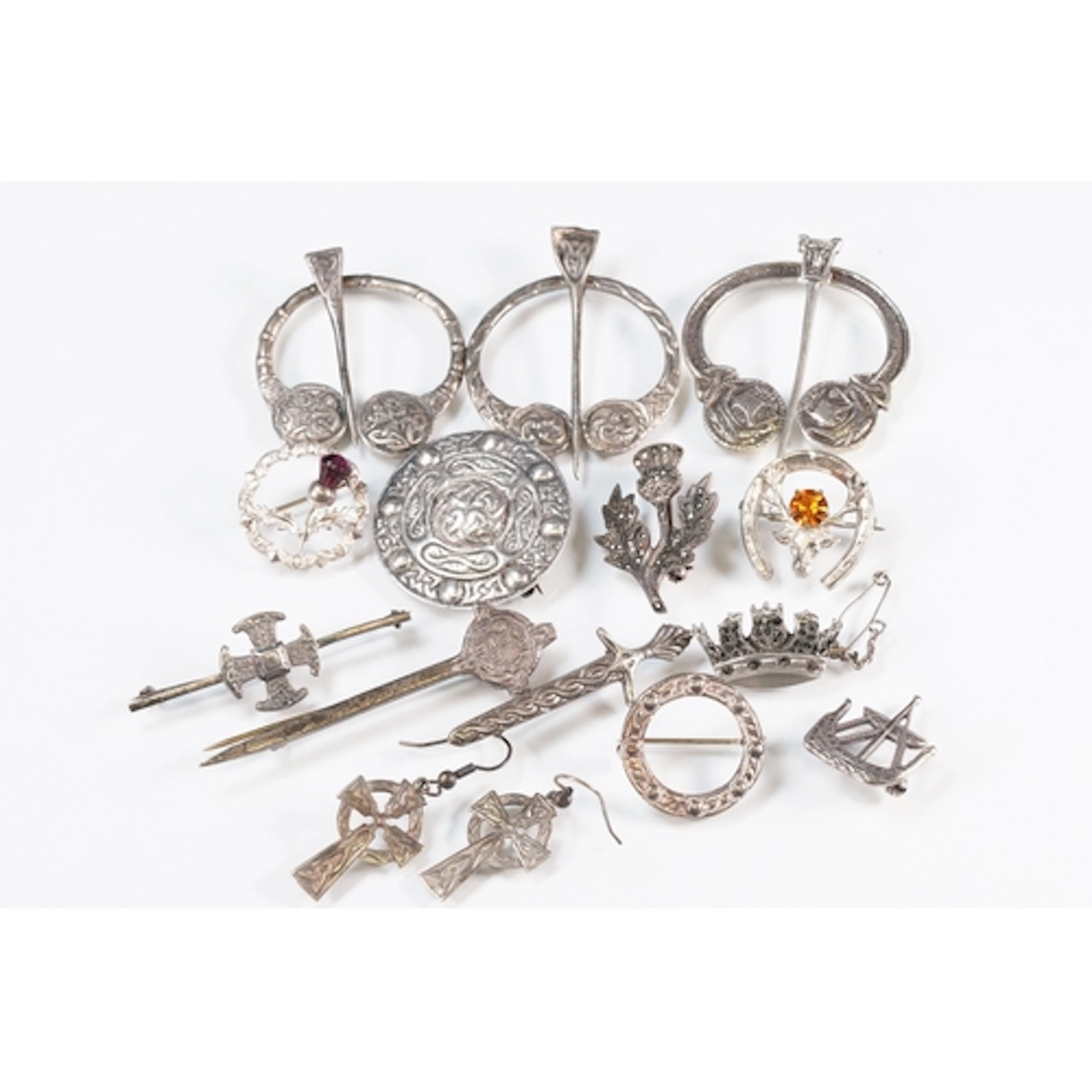 Collection of silver Scottish style brooches to include thre...