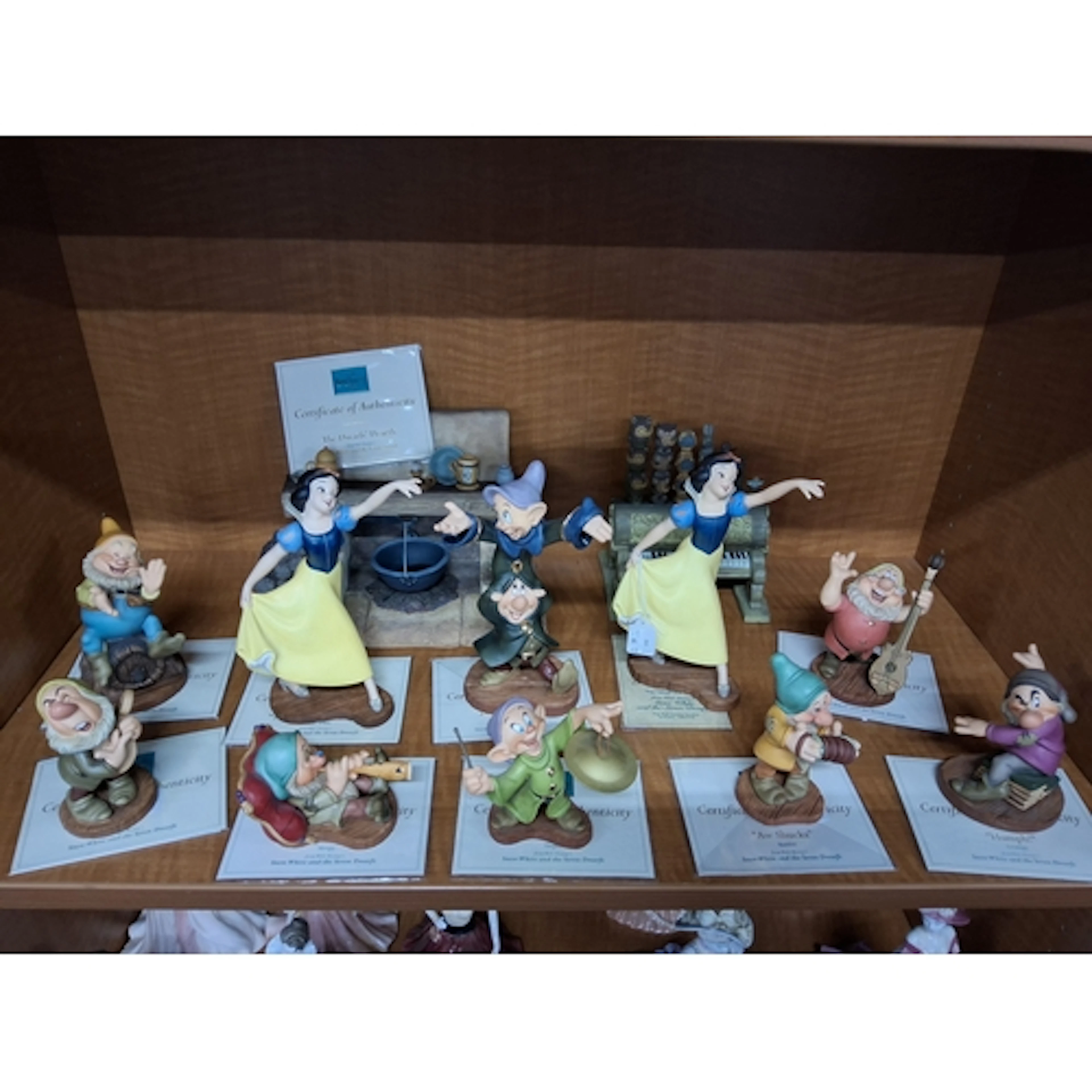 A GROUP OF TEN WALT DISNEY CLASSICS COLLECTION FIGURES, ORGA...